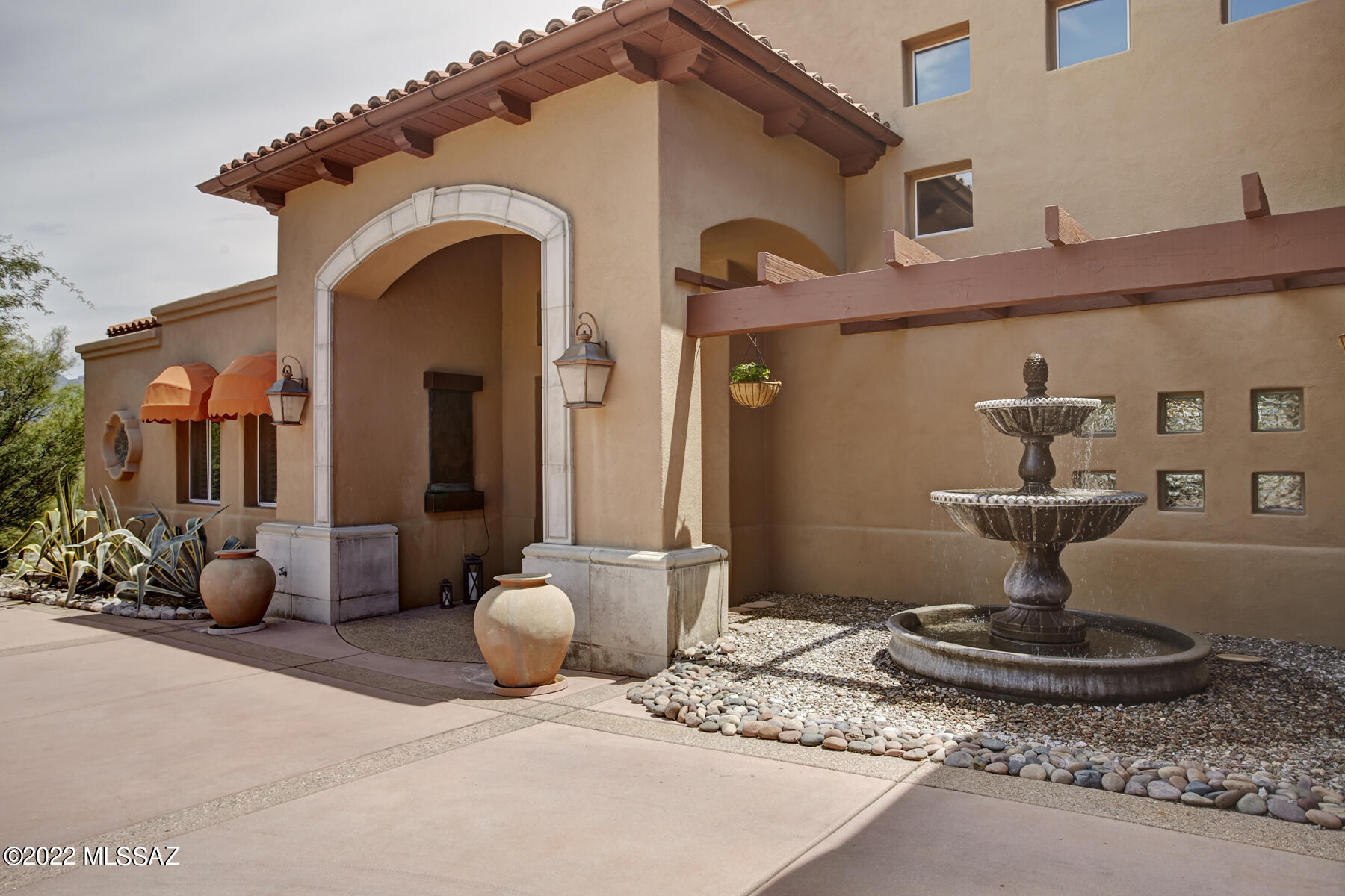 Outstanding  home with stunning views of mountains, Sabino Canyon and city lights in a gated community. On the main level primary bedroom  with fireplace, large walk-in closet with built-ins and garden tub, en-suite guest bedroom, formal living/dining room, spacious family room that opens to the Chef's kitchen. Upper level is a perfect retreat with loft and two bedrooms and bath. Deck off the loft offers outstanding mountain and city 
views. Beautifully landscaped backyard with patio, inviting pool & hot tub.