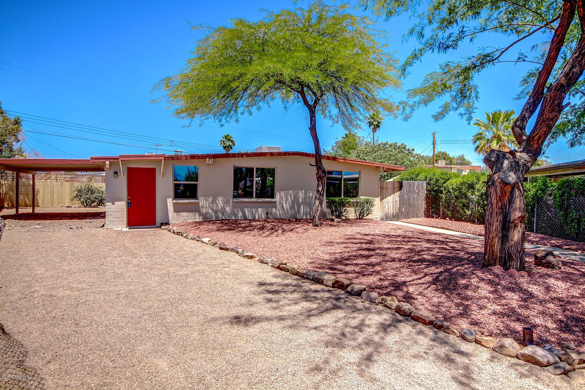 Seller will accept or counter offers between $139,900 and $144,900. Beautiful newly renovated home in the Peach Valley community of West Tucson! Pristine interior offers custom two tone paint, picture windows and gorgeous flooring throughout. Upgraded kitchen features custom cabinets, tile counters, stainless steel appliances and decorative subway tile backsplash. Each spacious bedroom has plush carpeting. Master bedroom includes an adjoining bath. Both baths have tile surround showers with decorative accents. Huge backyard has plenty of room for the ultimate oasis! This home is ready for your personal touches! See it today and start packing!