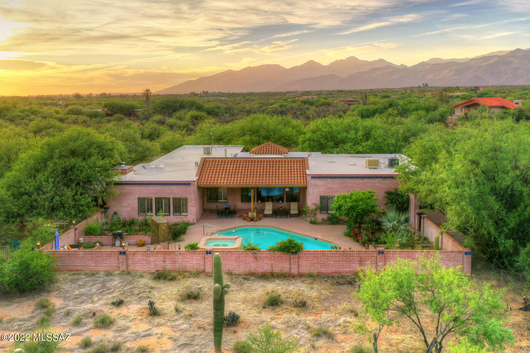 Southwest beauty in sought after La Cebadilla Estates nestled in a lush mesquite bosque on 4.1 acres. Rincon Mountains are a stone's throw away; you will enjoy a level of peace & privacy that is unparalleled. Paver courtyard welcomes you in to the lovely foyer & open expansive living room. Windows line the back of the entire home. Fabulous wood floors, exposed wood beam ceilings & plantation shutters are just a few of the many amenities this home offers. Split floor plan 5-bedroom, 4 full bathroom stunner with niches for displaying your most treasured collections. Intimate formal dining room, relaxing family room, wood burning fireplace, breakfast nook that opens onto the large kitchen & family room reinforce the feeling of luxury. The Primary Suite with attached library & lush bath... is the icing on the cake. All bedrooms are spacious with pretty views. Herb garden, fruit trees & an amazing rose garden welcome you to the covered brick paver patio with an oasis surrounding & privacy as far as the eye can see. Back yard with sparkling pool & spa, elevated seating area + incredible Rincon & Catalina Mountain views. Full bath outside keeps things tidy when summer fun leads you to the pool. Separate side yard is fenced and ready for more gardens, play area or whatever your heart desires. As is fitting for a home of this stature the space for storage is ample with a huge 3 car garage, workshop and 4 separate storage areas for keeping your new dream home organized. For buyers with an equine interest, this is a horse property as well. Tree lined circular drive, Tanque Verde schools with Saguaro National Park, Reddington Pass & McDonald Park just minutes away. Welcome Home!!
