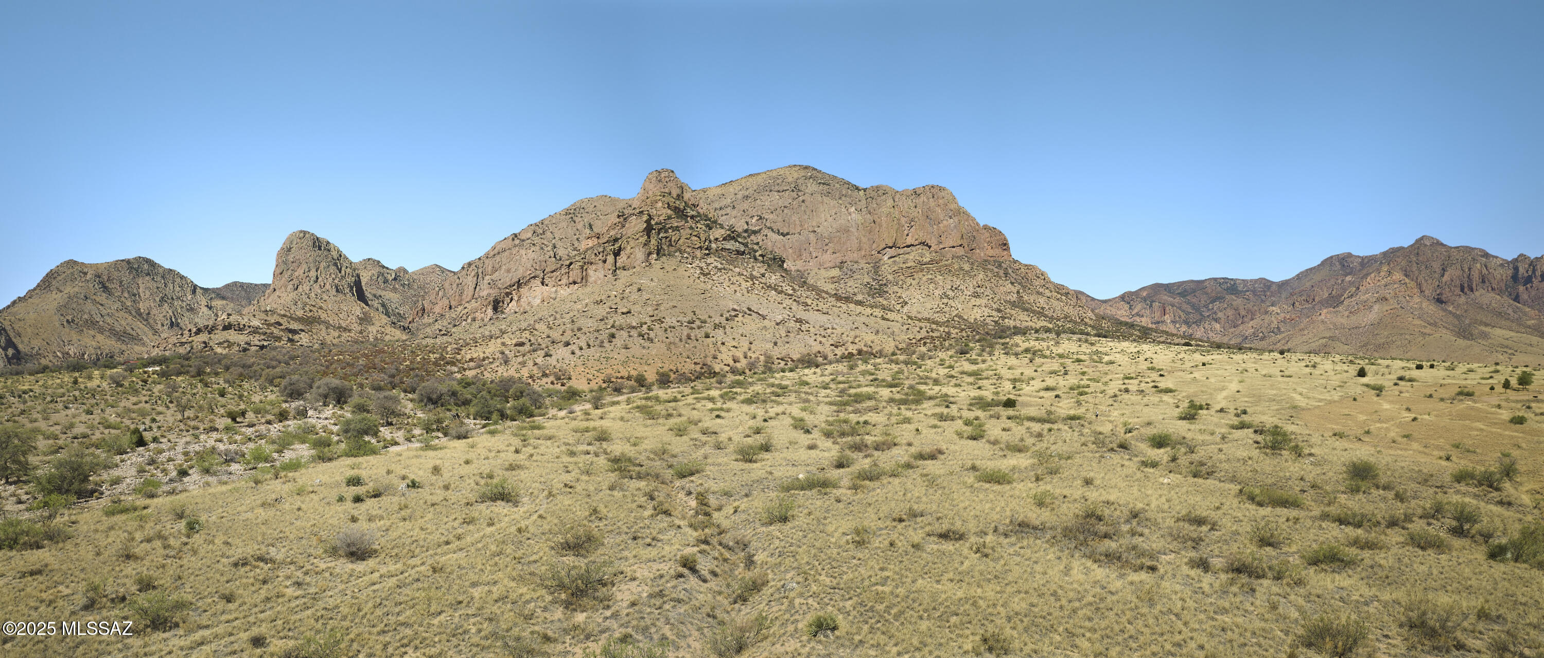 This 10-acre parcel offers both lifestyle and investment potential! Partially fenced on the south and east sides with power already on site, it's ready for your dream home, retreat, or future build. Just ½ mile off a county-maintained road, you'll enjoy easy access while still feeling tucked away. Take in panoramic views of Mangus Dome and the eastern slopes of the Chiricahuas, known for their wildlife, birding, and spectacular sunsets. Zoned RU-4, the property offers flexible use and division options—ideal for personal enjoyment today and investment.