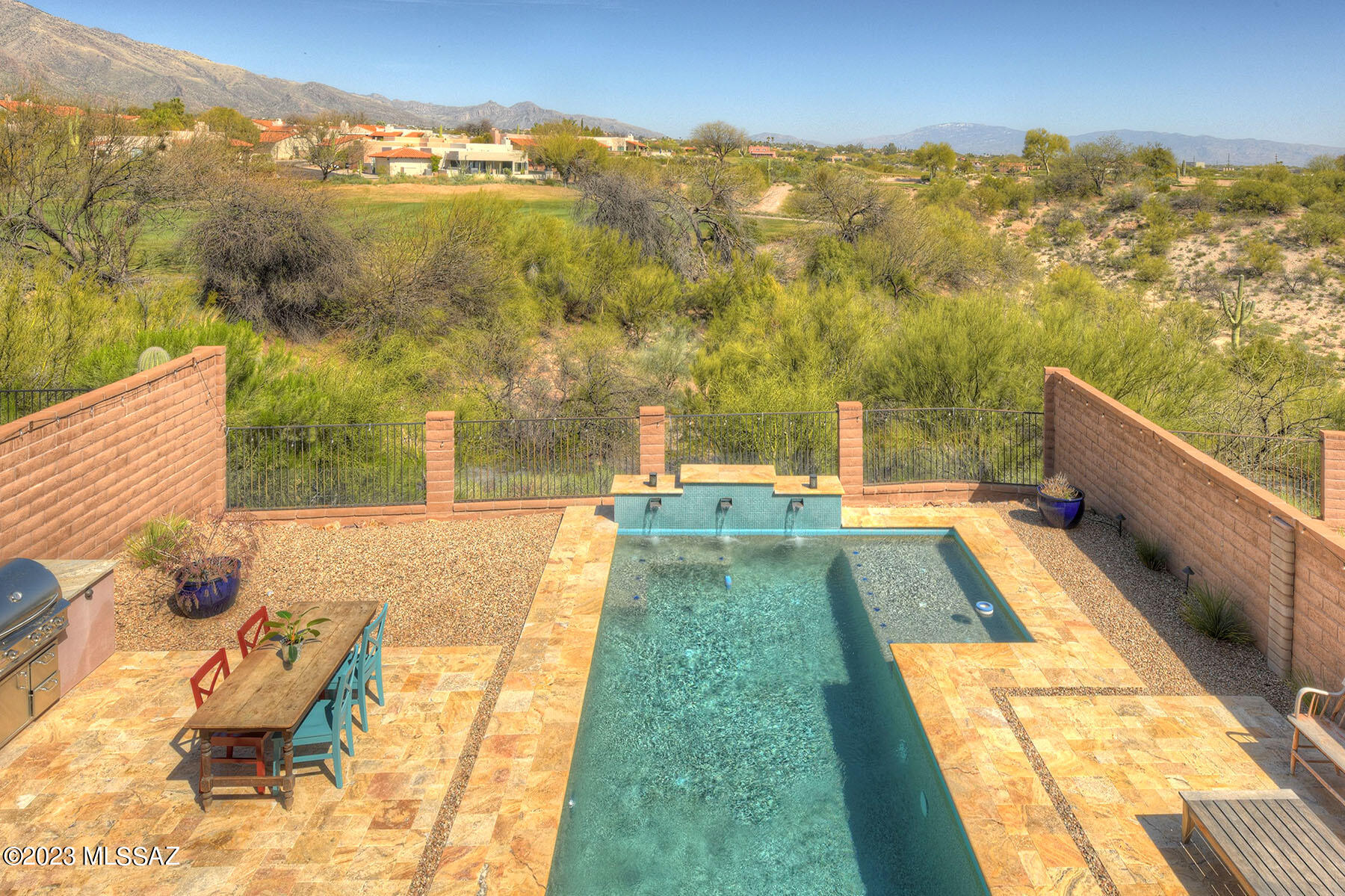 This luxurious single-family home is a true oasis, nestled in the picturesque Catalina Foothills of Tucson. Boasting over 3000 sqft of living space, this property offers the perfect balance of spaciousness and intimacy. With 4 bedrooms, 3 bathrooms, and a 2-car garage, this home is the ideal backdrop for all your family's special moments. The open floor plan creates an inviting atmosphere, with the living room, dining room, and kitchen flowing together seamlessly. The kitchen is a chef's delight, featuring gleaming granite countertops, a chic breakfast counter, and stainless steel appliances that will make cooking feel like a gourmet experience. The primary suite is a true retreat, with its spa-like bathroom, double walk-in closets, and breathtaking views of the surrounding mountains and La Paloma golf course.

The backyard of this property is a private paradise, with a sparkling saltwater pool beckoning you to cool off from the desert sun. As you float in the refreshing waters, you'll marvel at the stunning views of the mountains and La Paloma golf course, feeling grateful for this serene oasis you call home. Located in the highly coveted Catalina Foothills community, this home offers the perfect combination of luxurious amenities, stunning views, and a prime location. Top-rated schools, shopping, dining, and entertainment are just moments away, ensuring that you'll have everything you need to live your best life. Come experience the magic of this extraordinary property and make it yours today.