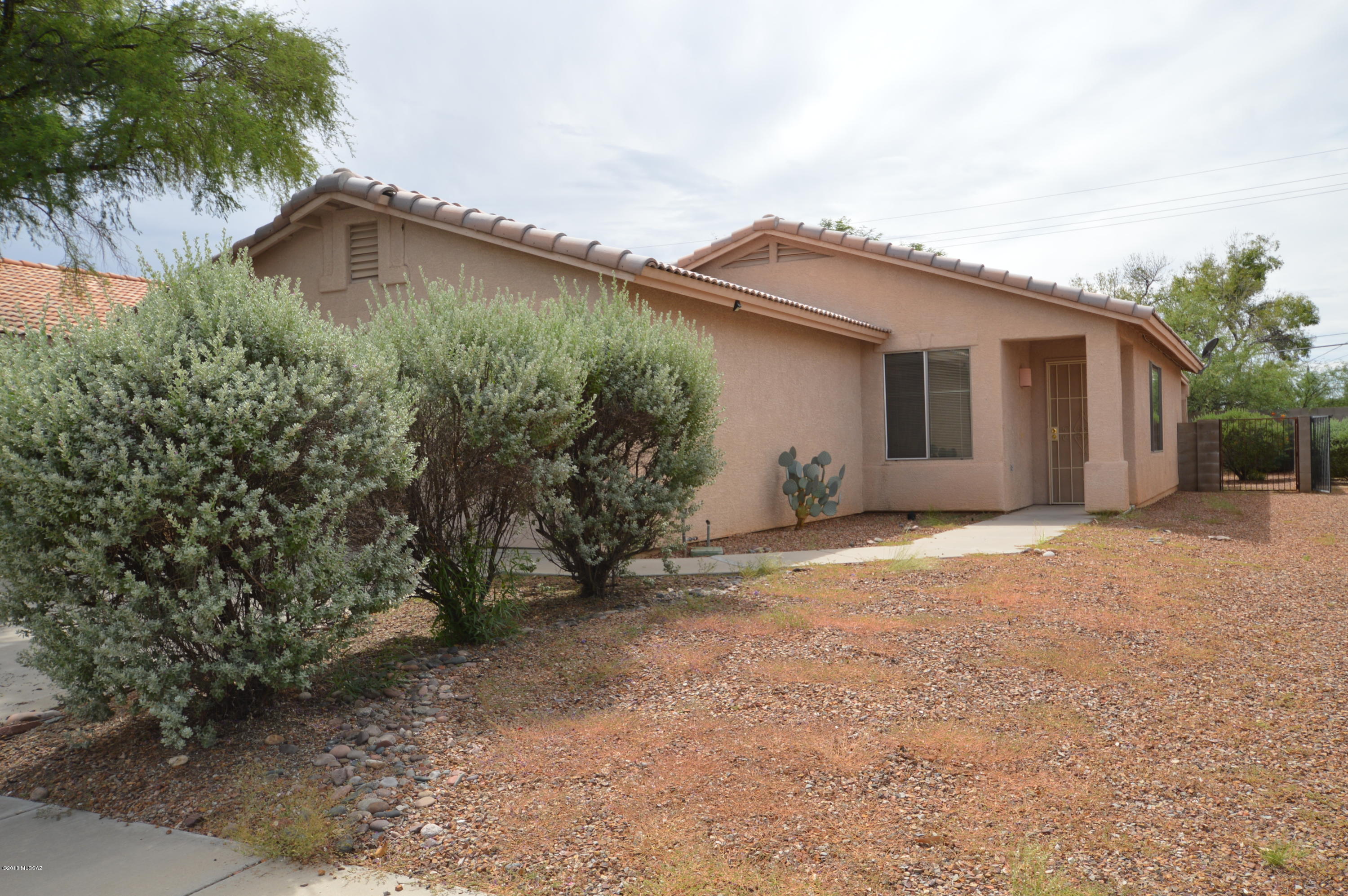 Lovely 3 bedroom, 2 bath eastside home with air-conditioning. Saltillo tile and carpet flooring. Covered patio in block wall fenced back yard for privacy. 2 car garage.