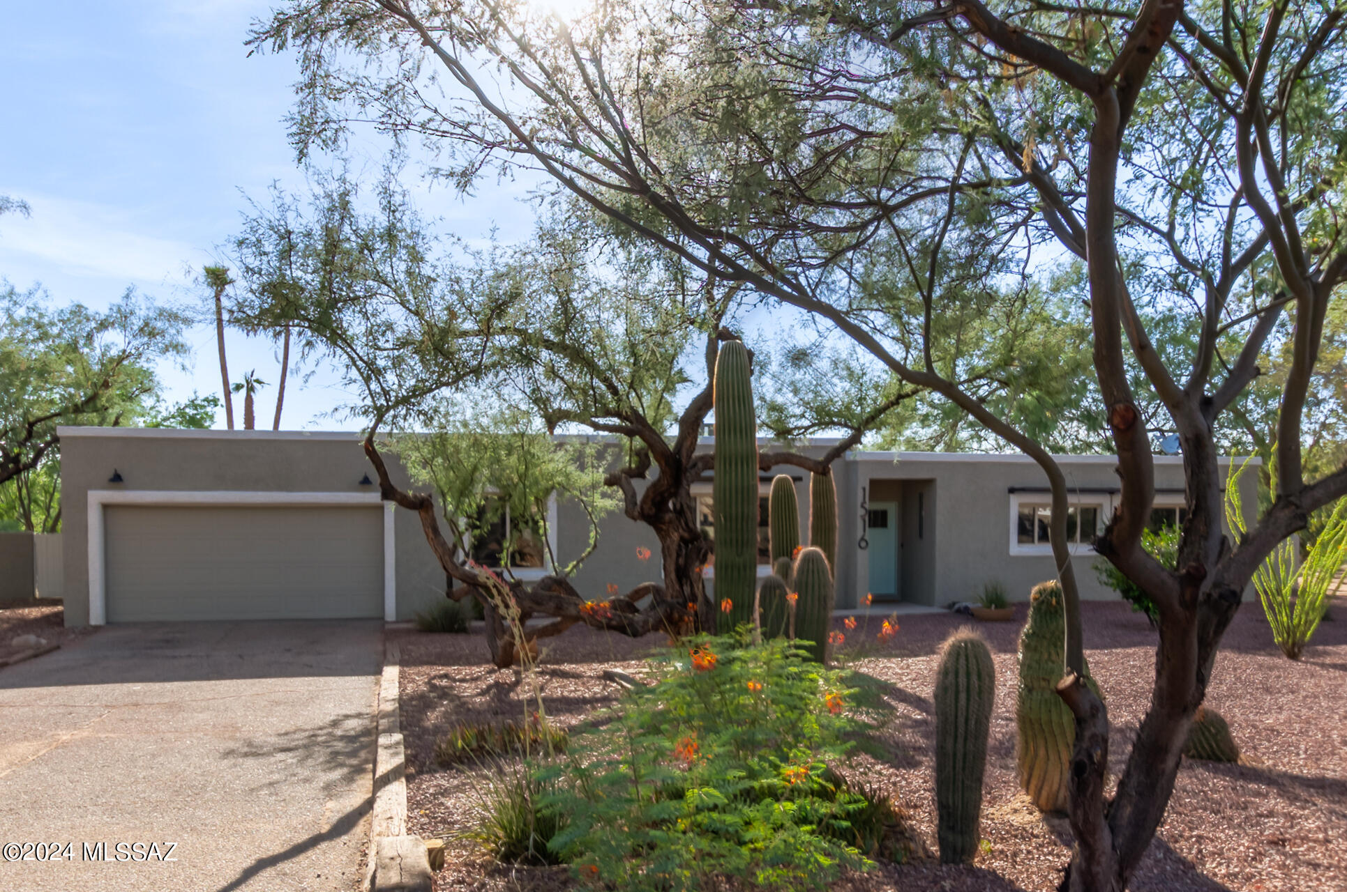 Fabulous completely renovated 4 bd/3ba residence in OroValley! Fully remodeled gem is nestled on a premium corner lot & boasts a lowcare landscape, 2 car garage & HUGE 4 car shop! Modern dining & living area w/high ceilings, recessed lighting, & fresh paint throughout. Continue into the family room, boasting a warm fireplace. The kitchen is comprised of wood cabinetry w/quartz counters, tile backsplash, stainless steel appliances, & a lovely breakfast bar. Relax & unwind in the primary bedroom, boasting stylish French doors & a pristine ensuite w/dual sinks. Don't forget about the elegant wet bar or the cozy den w/skylights! Finally, the sizeable backyard includes a covered patio & completely renovated pool! New AC & many more updates throughout! Don't miss!! Agent/Owner.