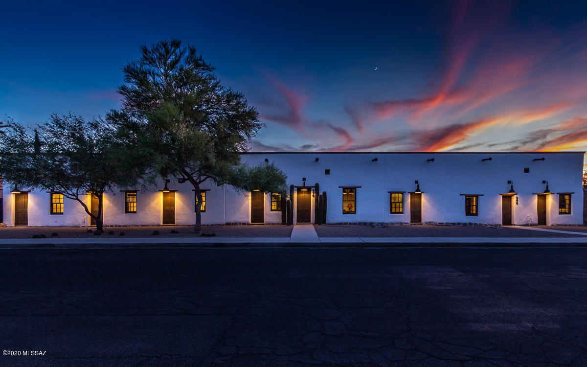 An amazing historic adobe home circa 1879 in the heart of historic Barrio Viejo, near downtown Tucson. A stunning example of a late-19th century Sonoran row house. Historic architectural details are present at every turn, while all systems have been updated for 21st century living. In addition to the 3 bedrooms in the main house, you'll find a cozy library and a media room. The owner's suite boasts an expansive dressing room with built-in cabinetry adjacent to the gorgeous owner's bath with an antique bathtub. Outdoor living space is plentiful with a spacious main backyard featuring a beautiful pool and pool house. In addition to a second private courtyard and ramada. The property includes a large attached 1 bed/1 bath guest house with full kitchen, laundry.