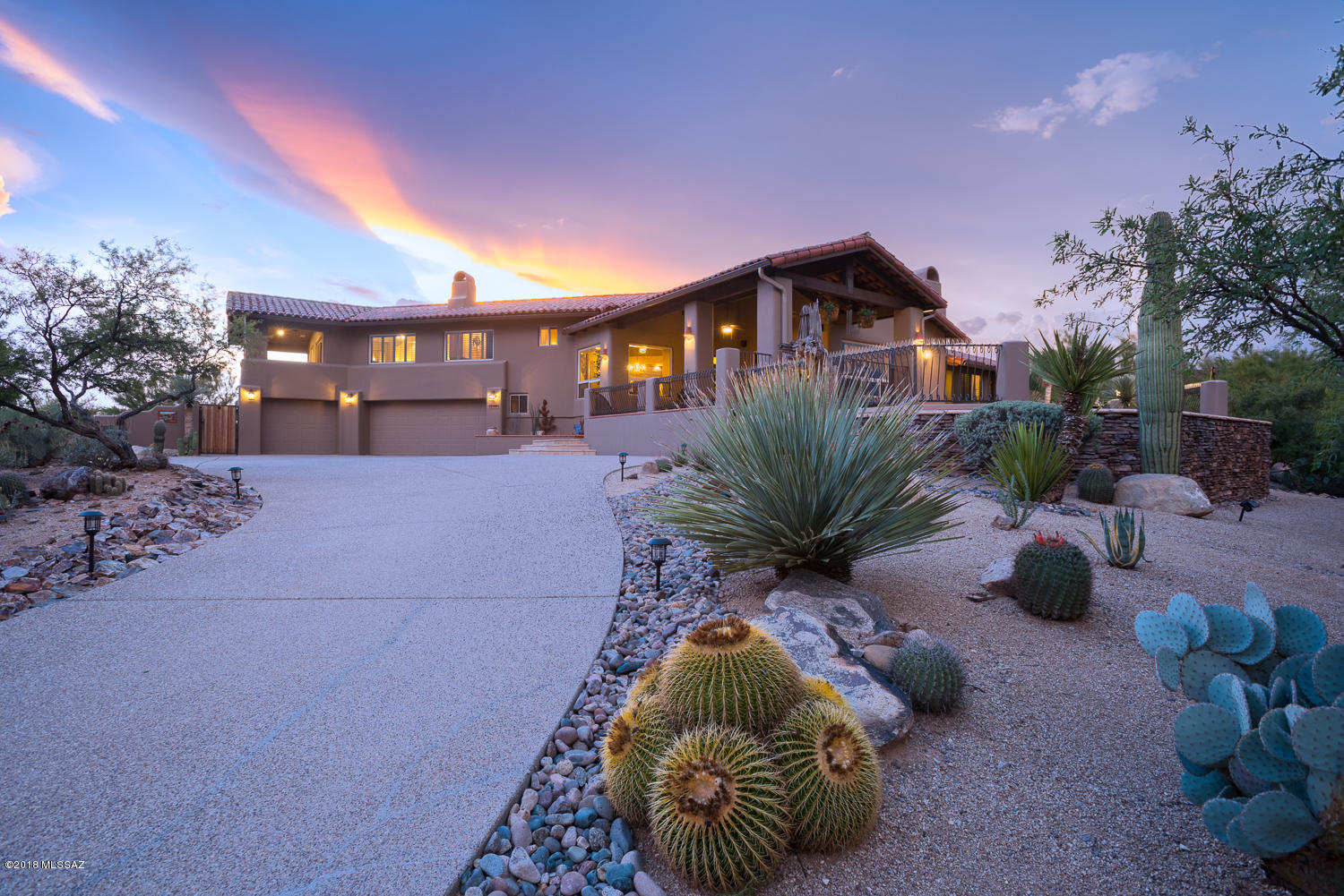 Right in the heart of Oro Valley, sits this amazing home located in a private cul-de-sac on an elevated 1.2 acre lot in sought after Coyote Ridge.  Sit poolside with mountain views in nearly every direction or stargaze at the Arizona sunset from the patio. Outdoor entertainment is elevated to new levels with the built-in BBQ accented with custom tile, expansive outdoor living space with three covered patios with wood beams/corbels sets the stage for indoor/outdoor entertaining. Entertain guests in the open concept great room showcasing a stacked stone gas fireplace, high vaulted ceilings, & a wall of windows for optimum views. The private master suite features a lovely seating area with a cozy gas fire place and its own exclusive access to the patio. A beautiful executive height granite vanity displays well in the master bath along with a jetted tub, an over-sized shower with new tile surround, and 3 closets for optimal storage space. Solid knotty alder doors and travertine tile throughout the entire house and carpet in the bedrooms. The gourmet kitchen features a stainless-steel double oven, a 5-burner gas cook top, and is open to the breakfast bar and additional dining area that boasts great views of the Catalina mountains. You will not find another property like this one!

Please see attached the feature sheet