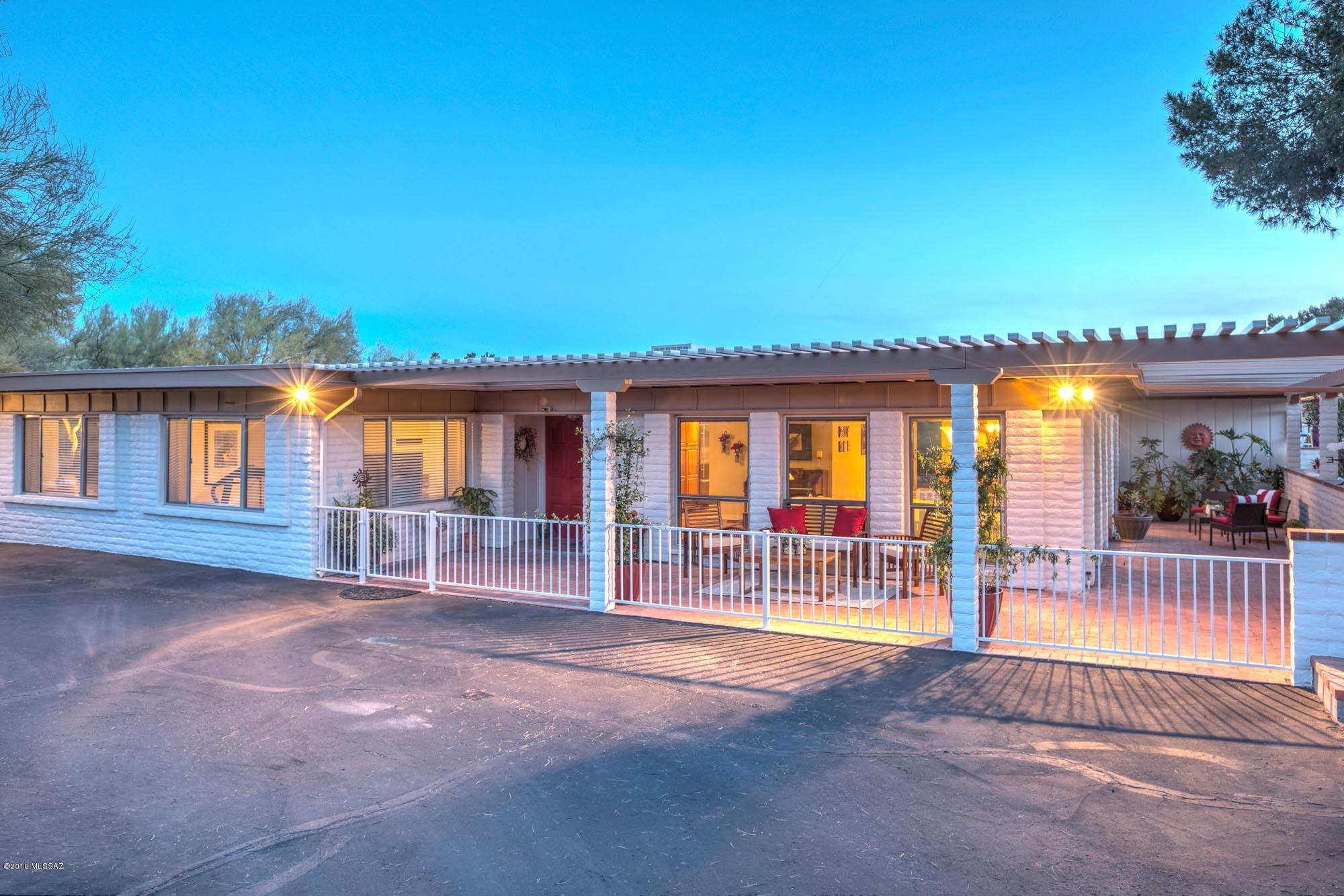 Open floor plan opens to a 1600sf covered patio making over 4500sf of living & entertaining space.  This is a well-maintained, turnkey property w/updated appliances, kitchen, paint, AC Unit, & driveway. HOA fees are less than $25/mo, giving homeowners access to a community pool, Rec. center, & tennis courts. It's located in the Catalina Foothills District, & has gorgeous mountain & city views. Dining Room & Living Room are combined for a stunning Great Room, w/additional dining bringing the Kitchen & Family Room together with a fireplace. 2 north facing rooms have their own office/exercise room. The laundry room is huge! Three large skylights add light in the bathrooms & kitchen. Garage is oversized in L&W, 2 full Driveways, water softener & conditioner, 150sf storage & Triple Pane Windows Great open floor plan opens to a 1600 sq ft covered patio making over 4500 sq ft of living and entertaining space.  This is a well-maintained, turnkey property with updated appliances, kitchen, paint, AC Unit, and driveway. HOA fees are less than $25 a month, giving homeowners and their guests access to a community pool, Rec. center, and tennis courts.  If location is a priority - it is located in the Catalina Foothills School District, and has gorgeous mountain and city views. Floor plan is designed with Dining Room and Living Room combined for a stunning Great Room, with additional dining bringing the Kitchen and Family Room together with a fireplace for cool winter days. Two of the north facing rooms have their own office/exercise room/hobby space with amazing light. The laundry room is massive, with a half bath attached.  Three large skylights add beautiful light in the bathrooms and kitchen, and ceiling fans can be found throughout the home. The Garage is an oversized 2-Car Garage in length and width, with plenty of room for tools and a large workspace.  Additionally, there are 2 full driveways for plenty of additional parking.  To make things more appealing, the house has a water softener and conditioner installed, extra 150 sq ft of storage, and triple pane windows.