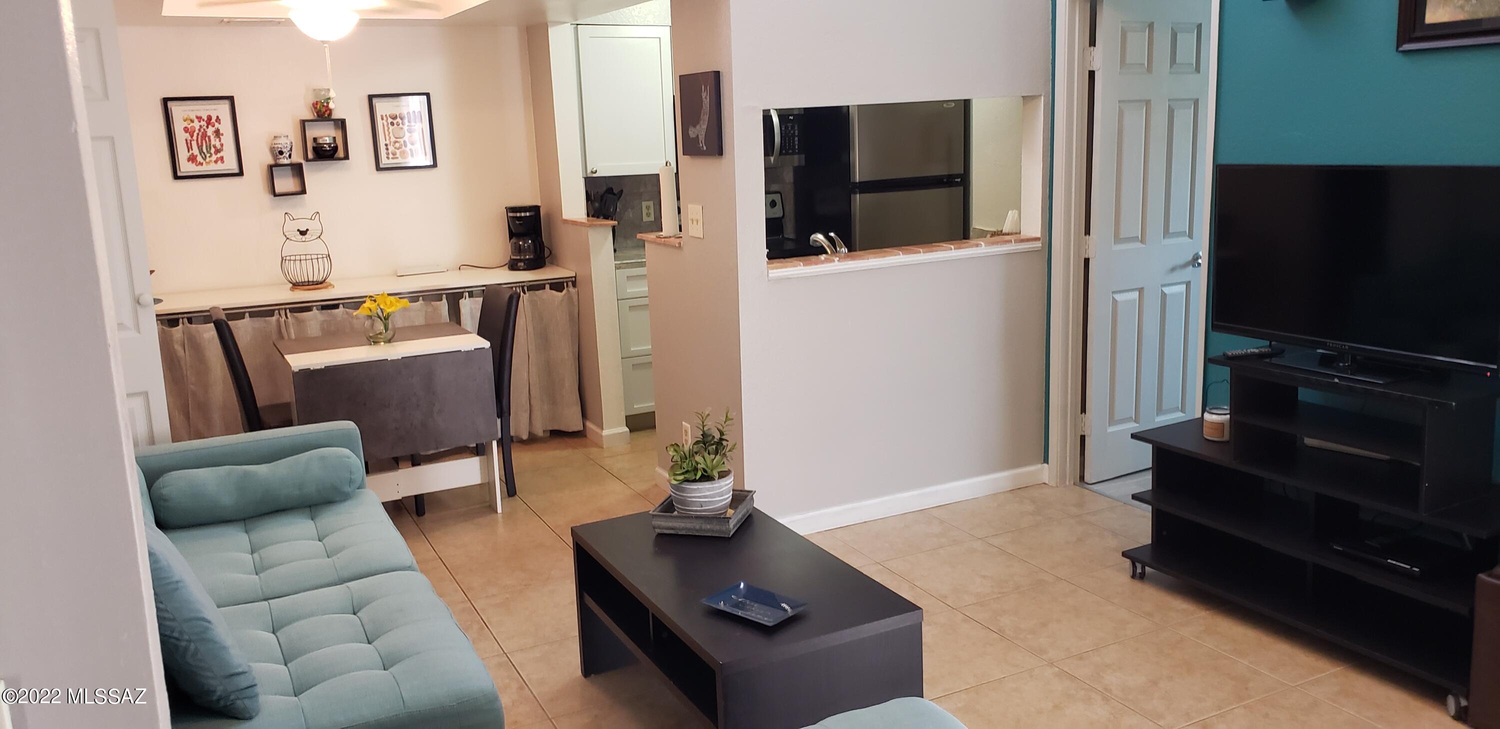 Own this light and bright 2 bedroom 2 bath condo (on the 2nd floor) in the heart of Tucson. Mountain Ave (bike route) is just a skip away for getting to the UofA or up to the Rillito River bike path. Restaurants, Grocery stores and Starbucks are an easy walk away.
Sellers have beautifully updated the bathrooms and kitchen which has stainless appliances, white shaker cabinetry  and marble tile counters.
This condo is ideally located within the community, close to the 2 parking spaces that it includes. The tiled balcony overlooks the grass, pool area and clubhouse which includes a kitchen, seating area/television and small fitness room. 
A washing machine is included in the unit. 
This condo has been used as a vacation rental and is coming completely furnished incl furniture, dishes etc.