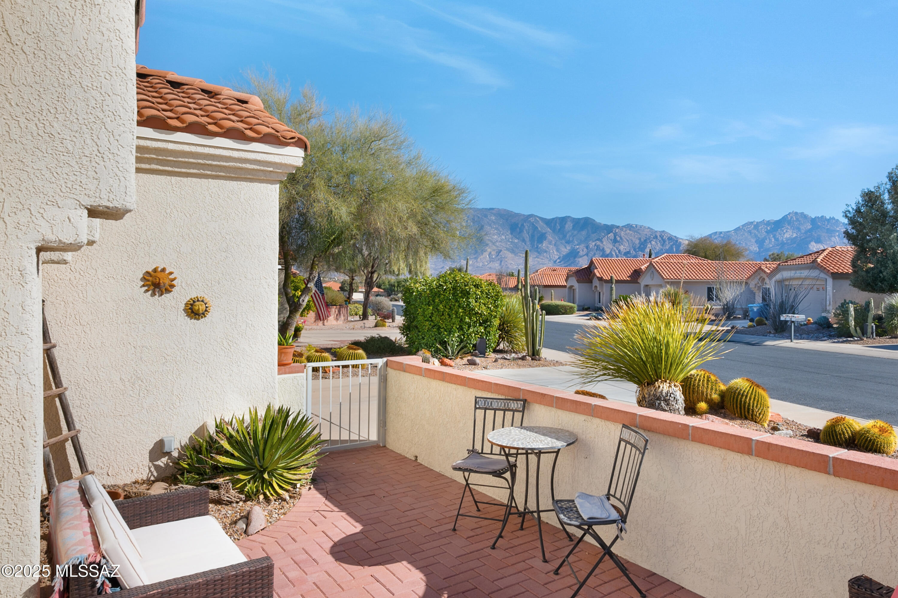 Fabulous Sun City Vistoso Oro Valley Montara model home with two bedrooms, two bathrooms and great room. Updated kitchen with dove-tailed, soft close cabinetry with crown molding, white appliances and granite counter tops. Neutral tile throughout living areas. Relaxing rear patio with Ramada, pavers, hot tub that opens to state land. Wonderful walled in front patio with terrific mountain views. Updated roof underlayment and HVAC system. Terrific opportunity. Exterior freshly painted.