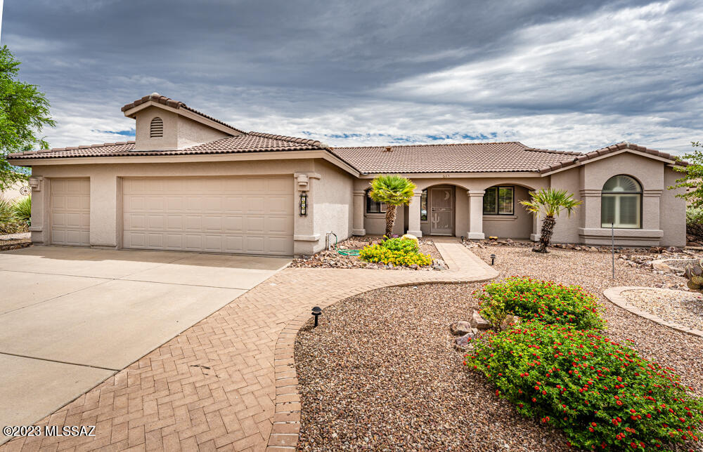 Lovely home with 3 bedrooms and a den.
Super Views and large covered patio.  Vaulted ceiling, fans, solar tubes and Tile flooring in all the right places.  All this in the wonderful Portillo Ridge neighborhood! The kitchen has newer appliances, granite counter tops, loads of windows and you can access the back patio for grilling --natural gas hook up! Mature landscaping with citrus trees.  Great space in the 2.5 car garage. Architectural features thru out... you will enjoy displaying your art and family treasures.   Newer kitchen appliances and HVAC...Roof work 8/2023.