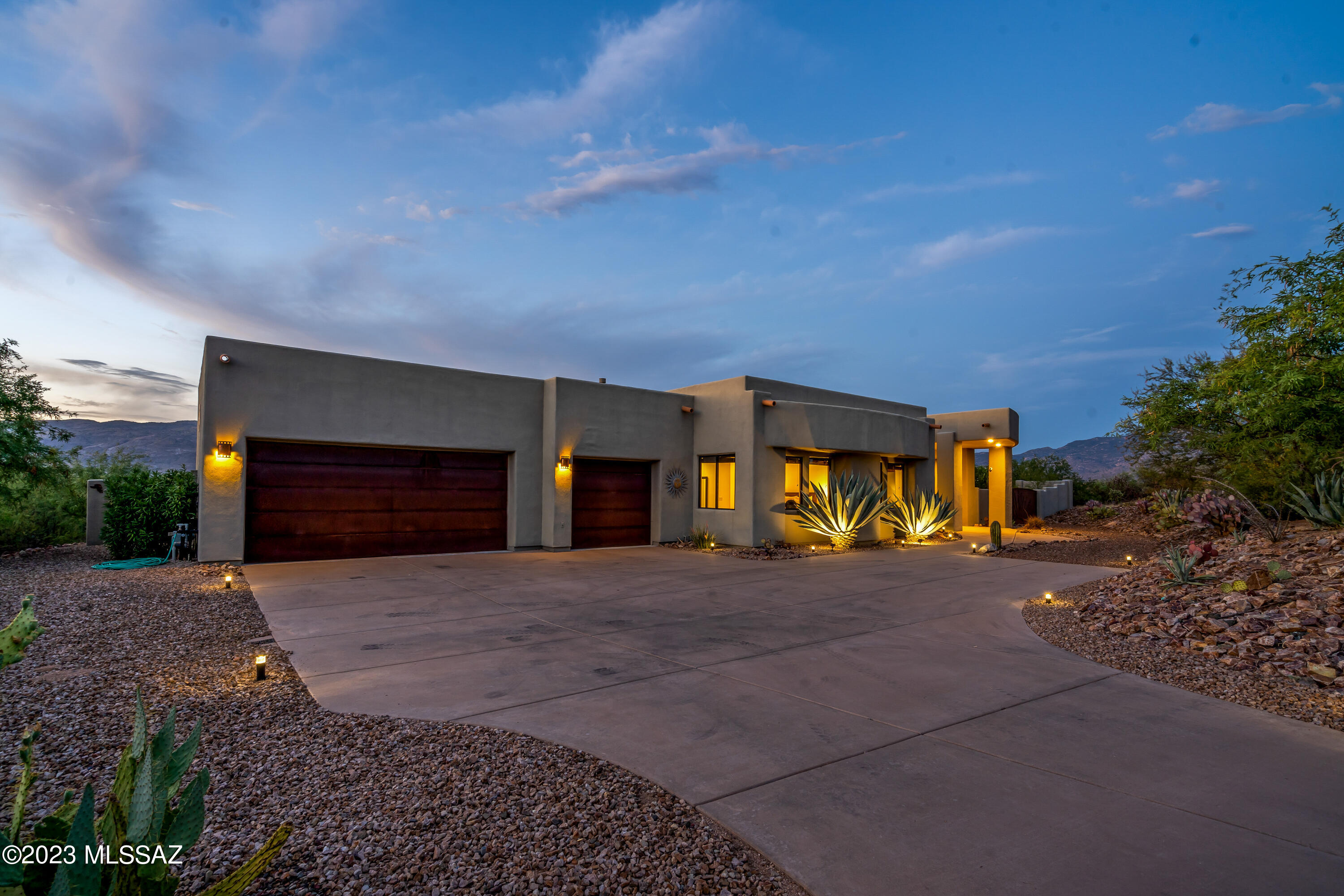 Step into the open-concept great room, graced with soaring 13' ceilings, and be captivated by the awe-inspiring views that surround you. It's a space designed to inspire and delight, perfect for entertaining and making cherished memories. The gourmet kitchen is a chef's paradise, featuring 42'' cherry cabinets, stainless steel appliances, and an oversized kitchen island with a stylish breakfast bar. It's the heart of the home, where culinary creativity and gatherings come to life. 
The sprawling outdoor space offers endless possibilities for entrainment and leisure, making it an entertainer's paradise.  Let's not forget about the Pebble Tech pool and spa in this backyard oasis with over 1500 sf of covered patio..  Imagine hosting gatherings with loved ones, sipping cocktails by the pool