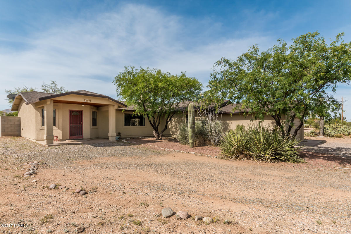 Enjoy the peace and quiet in your own private oasis. Very nice family home with four bedrooms, 2 full baths and 2 car garage on over an acre with mountain views. current owner has made over $124,000 in updates including new roof (2015), new ext. paint (2015), kitchen remodel (2013), new water softener (2016, enclosed backyard, large shed in side yard (10x12'), updated bath vanity and low flow toilets, updated flooring and much more (see list under documents tab). BBQ for friends & family underneath the grand entertainment area. Spa (2015), grill and tv all included! Whip up a gourmet meal in the beautiful remodeled kitchen with granite counters, upgraded cabinets & SS appliances. Kitchen opens to formal dining area and family room so you can entertain your guest too! No HOA. Close to I-10 for easy access to UofA Tech park, Davis Monthan, shopping and amenities. Award winning Vail School District.