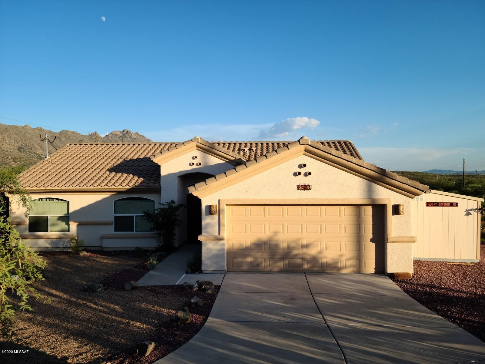Wonderful home on 3 parcels. This home has been upgraded with many extras and cared for in such a good way. Beautiful front, side and back yards, top of the line Tuff shed attached and painted to match the home. A custom stone fireplace and BBQ in the backyard along with a full size greenhouse. Flagstone front and back as well. Also has a 16KW generator with 66.6 amps with a fully automatic transfer switch, 250 gal. propane gas. Home has a solar power system as well. All these amenities stay with the property. A must see!!!