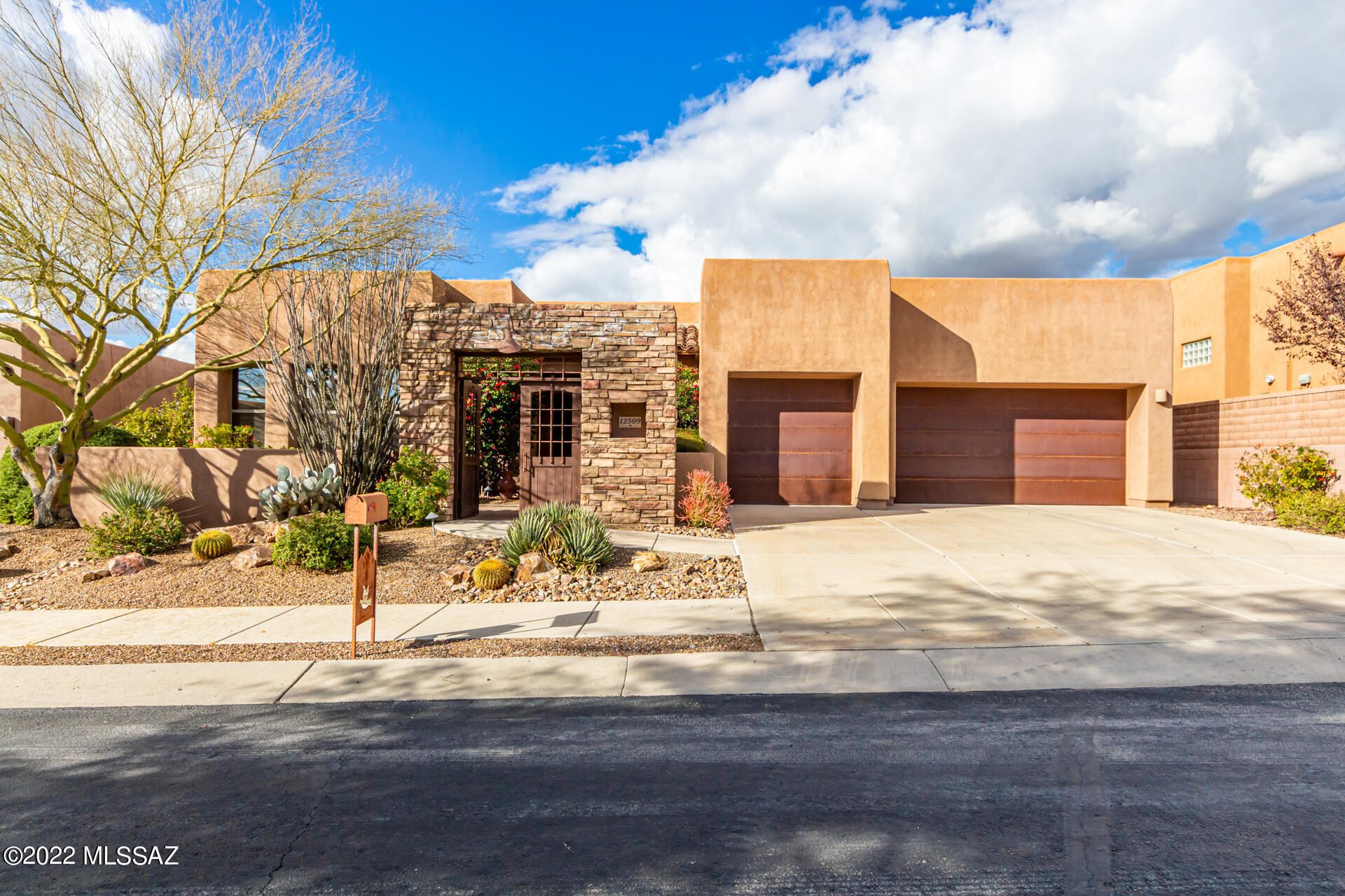 Beautiful Insight Home available for the first time.  This is an immaculate, great room split bedroom floorplan with separate entrance casita.  This 4 bedroom/3 bath offers it all. Mature landscaping greets you as you drive up to the triple garage w/rustic metal doors, followed by a double gated courtyard entrance to this wonderful home. Main home boasts soaring ceilings in great room, 8' doors, upgraded cabinetry, 20' tile floors except in  bedrooms, upgraded carpeting in bedrooms, gourmet kitchen w/slab granite countertops, island, SS appliances to include convection oven, with Dining area w/additional cabinetry & chandelier. Luxurious master suite w/patio door to extended covered patio & back yard, offers dbl vanity, large walk in closet, separate tile shower & soaking tub. The laundry is oversized with sink, washer, dryer, additional cabinetry and space for wine cooler. 2nd & 3rd bedrooms are both are oversized w/ample closets, ceiling fans, wood blinds and storage. Casita has a separate entrance and offers privacy for your guests or can be used as home office or workout studo and offers a walk in closet,ceiling fan, plantation wooden shutters, ensuite bathroom features a walk in snail shower and linen closet. The inner courtyard has multiple seating options, tranquility & privacy for both homeowners and guests. The separate entrance to the casita is accessed through this inner courtyard.  The back yard is large with a structural, extended covered patio of pavers, built in BBQ with separate burner and has space to build your custom pool.  It overlooks the Preserve, Tortolita Mtns and amazing Arizona sunsets!!! This home has hardly been lived in and offers a tremendous value.  Call for your private showing today ~ this home is truly a GEM!!!
