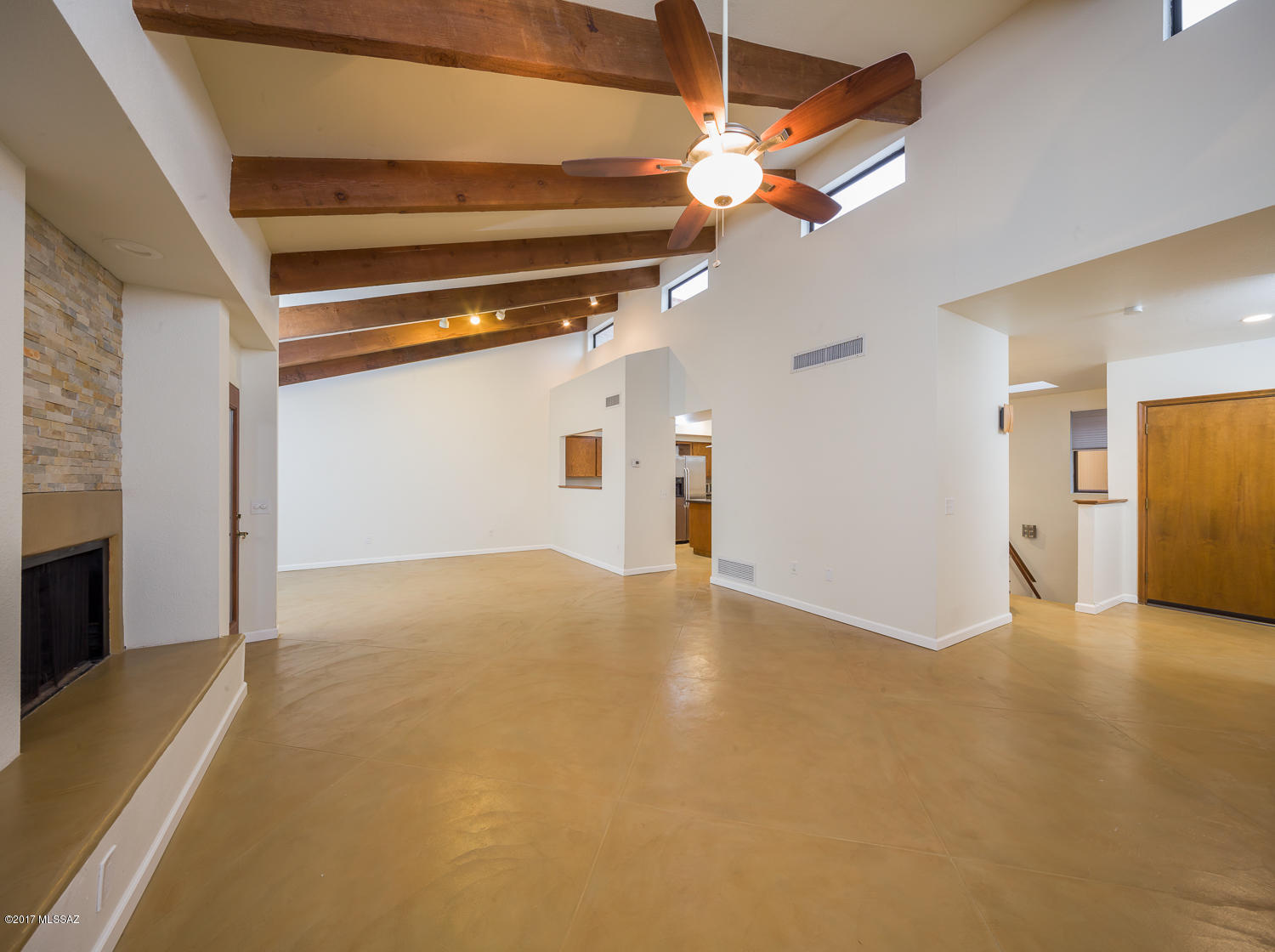 Snowbirds! (or anyone else!) If you are looking for a turn-key TH that you can lock and leave, this is it! This beautiful contemporary home in a saguaro studded foothills location is waiting for you! You will love the vaulted ceilings, the views through the multi-pane glass, great kitchen with modern appliances, big fireplace, and generously sized bedrooms. New gas pack HVAC 3/2017. Outstanding Rojo's styled scored concrete flooring in the great room! Located only minutes away from the U of A and Downtown, you will enjoy Catalina Foothills living at its best, without the drive! Don't miss the community pool that overlooks the lush desert greenery, including majestic saguaros! There is nothing quite like this at this price in the close-in Foothills area. This is a must see.
