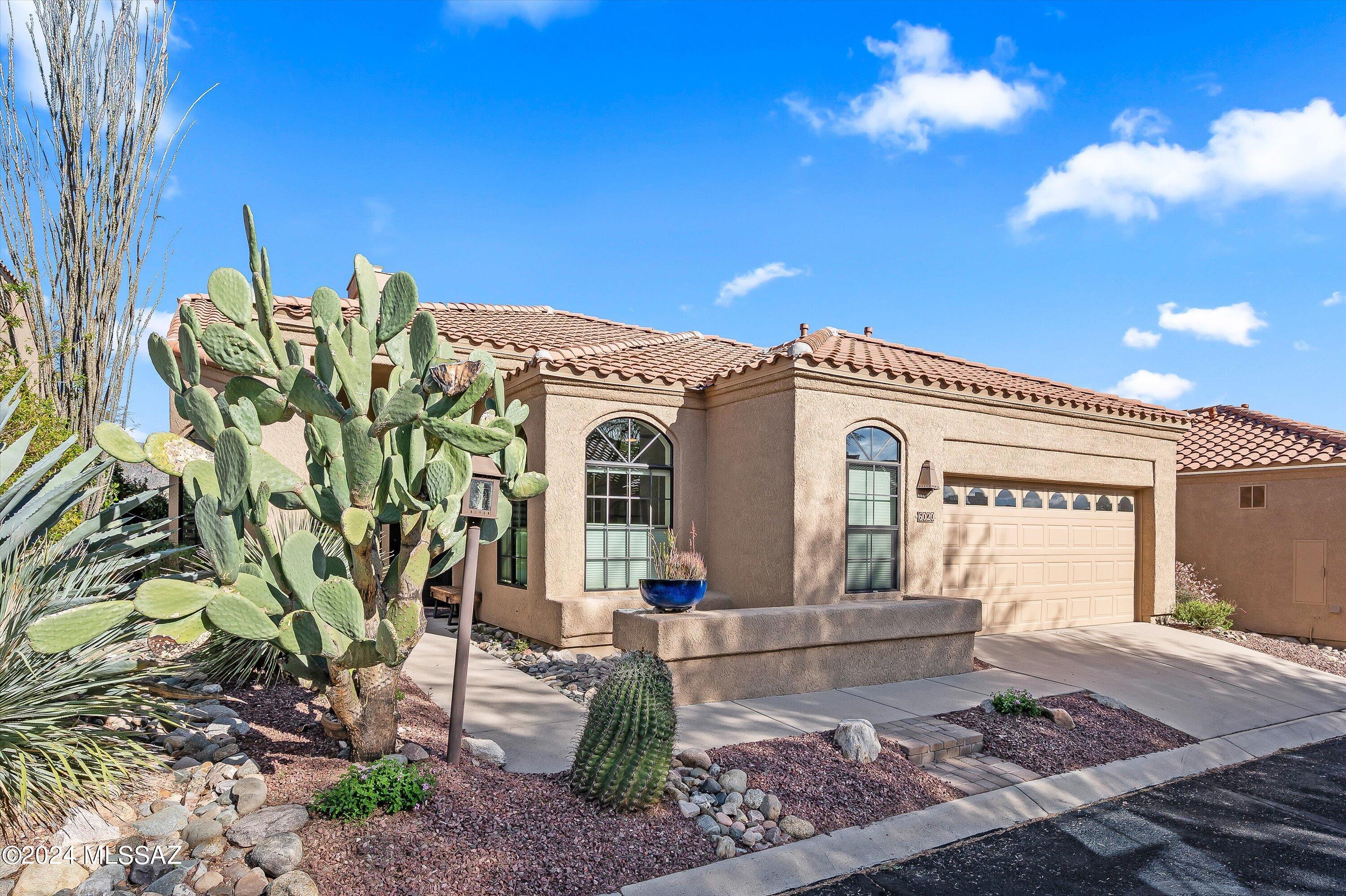 Step into the elegance of this tastefully remodeled ''Golf Villa'' on a premium lot bordering lush desert common area. Located just across from the hole 9 tee box of the Canyon Course it has incredible unobstructed mountain views. Enjoy the sunrise over Sabino Canyon's Thimble Peak from the breakfast area, kitchen, living room, master suite and covered patio.  Located in exclusive Ventana Canyon Golf and Racquet Club, this two bedroom, two bath, plus office/den has it all. Quality finishes and décor abound, including custom wood and security doors, designer lighting fixtures, gorgeous cabinetry, gourmet kitchen with stainless appliances. 18' vaulted ceilings and high-fashion Minchella window coverings included throughout. Hardwood flooring in master suite with limestone in the master bath From the moment you enter you will feel the elegance and quality of the space all around you.  New patio pavers, drip sprinkler system, automatic exterior in-ground lighting, and ring doorbell.  Epoxy flooring and built-in cabinets in the air conditioned garage.	Furnishings may be available.
