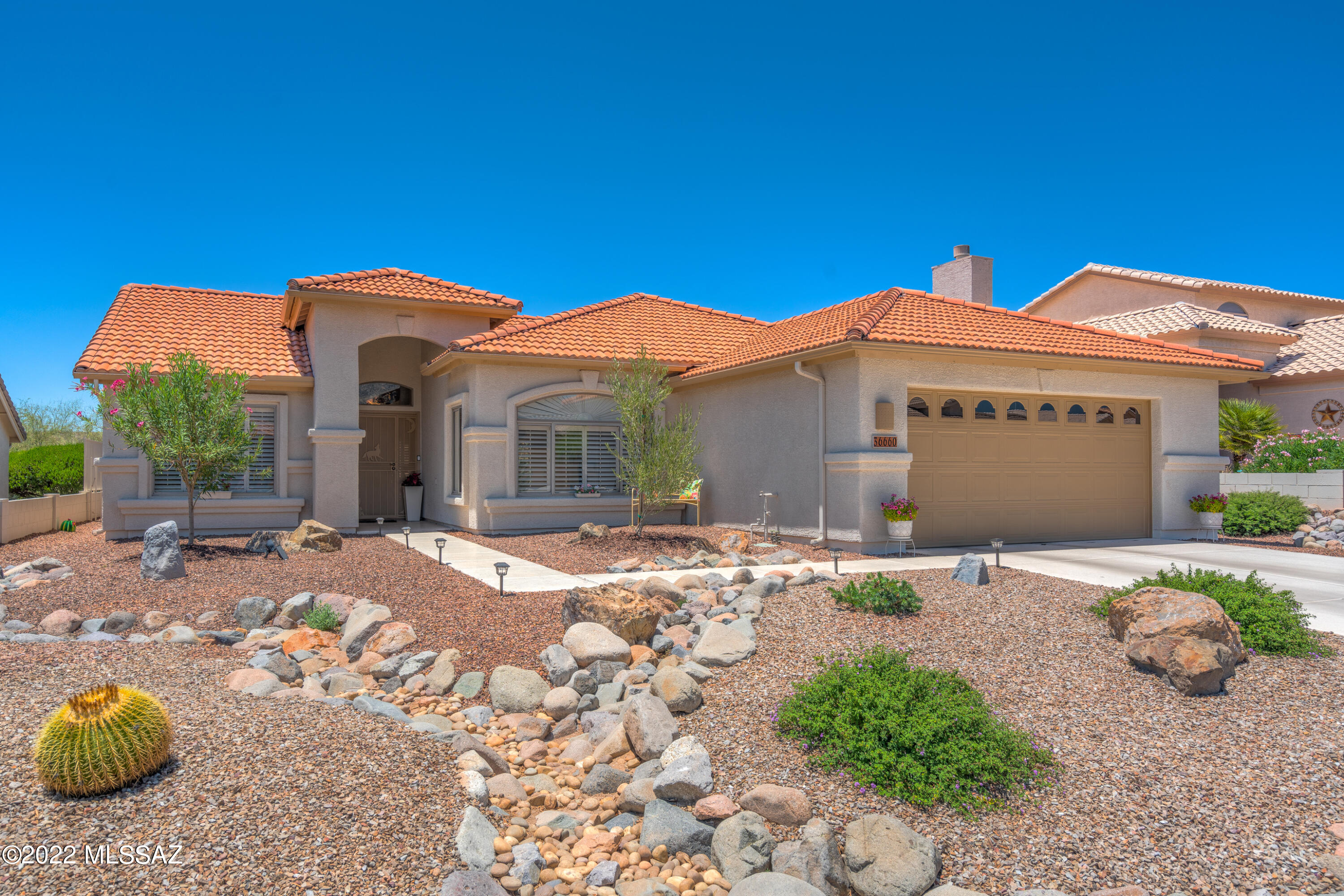 Immaculate 2BD/2BA +Den (1,844 sq ft) Laredo plan on golf course boasts a sprawling screened-in patio, sparkling pool and front Catalina views. Open-concept Great room plan showcases ceramic tile, soaring vaulted ceilings, archways and wood shutters throughout. Large living space accesses patio. Chef's kitchen offers stainless appliances, ceramic counters, island, breakfast bar and large dining nook. Split bedroom plan hosts Owner's suite w/bay window, dual sink vanity, walk-in shower & closet plus a guest room with hall bath. Large Den off foyer has Catalina views. Extended, epoxy coated garage w/storage cabinets. Relax on the screened-in patio or enjoy the tranquil pool w/rock waterfall while overlooking the hill and golf course. SaddleBrooke is Tucson's Premier Active Adult Community.