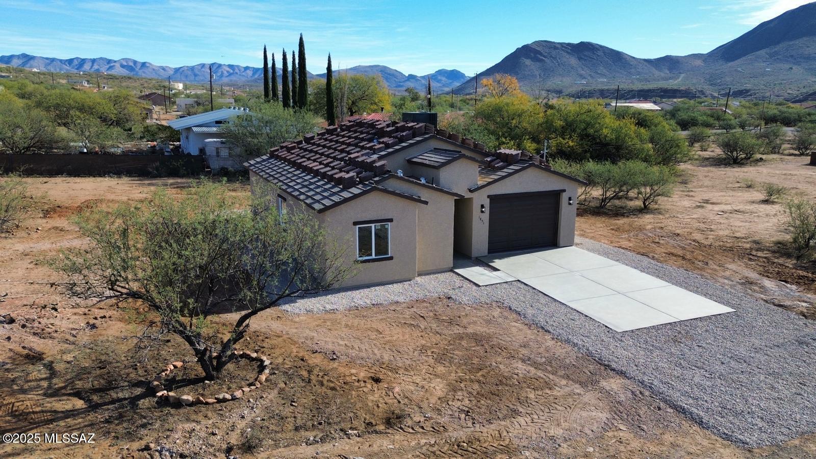 Beautiful New Construction Home in Rio Rico. Welcome to this fully refreshed 3-bedroom, 2-bath single-family home offering  modern comfort and convenience. Set on a desirable corner lot with no HOA, this property gives you added space, freedom, and unobstructed views.
Inside, the home features brand-new tile flooring throughout, creating a clean and cohesive feel. The kitchen stands out with stainless steel appliances, abundant counter space, a spacious island, ample cabinetry, and a walk-in pantry—perfect for cooking, entertaining, and everyday living.
Wake up to stunning mountain views and enjoy peaceful surroundings while still being just 5 minutes from the freeway, offering quick access to shopping, dining, and local amenities. 
Set to be completed beginning of December!