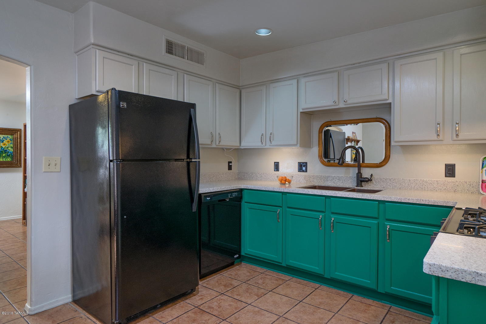 This charming home exudes character and is perfectly located near shops and restaurants. All Kitchen Appliances are from 2014 or newer and the sink is a premier copper product. This bright and open concept features 3 bedrooms and 2 baths. Fresh paint and tile throughout. The backyard is incredibly spacious and could be an entertainer’s dream. This home is designed for Water Harvesting if desired by future buyer. 4 Fruit Trees. Metal fence was designed and built by a local welder artist.