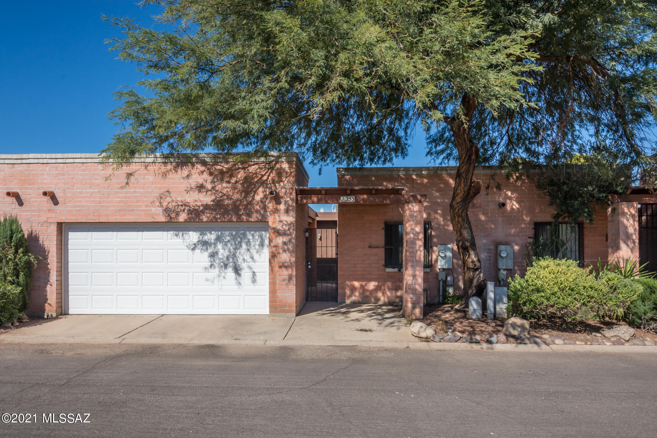 Welcome Home to this updated central townhome in a great location. Features include high ceilings, large Great Room, spacious Kitchen with new Range and Dishwasher, Breakfast Bar, Pantry, lots of cabinets and counter space. Primary Bedroom has a huge Walk In Closet and Custom Bath with a large tiled Shower and Vanity with built in shelves and linen storage. Tiled floors throughout with new carpet in the bedrooms, interior was recently painted, HVAC is 1.5 years old, newer garage door and opener, roof was just repaired and re-coated with warranty. Enjoy the fenced back yard, Covered Patio with attached Storage Room, 2 Car Garage with built in storage cabinets and gated front entry. Community Pool is around the corner and plenty of Guest Parking is available. Move Right in and Enjoy!
