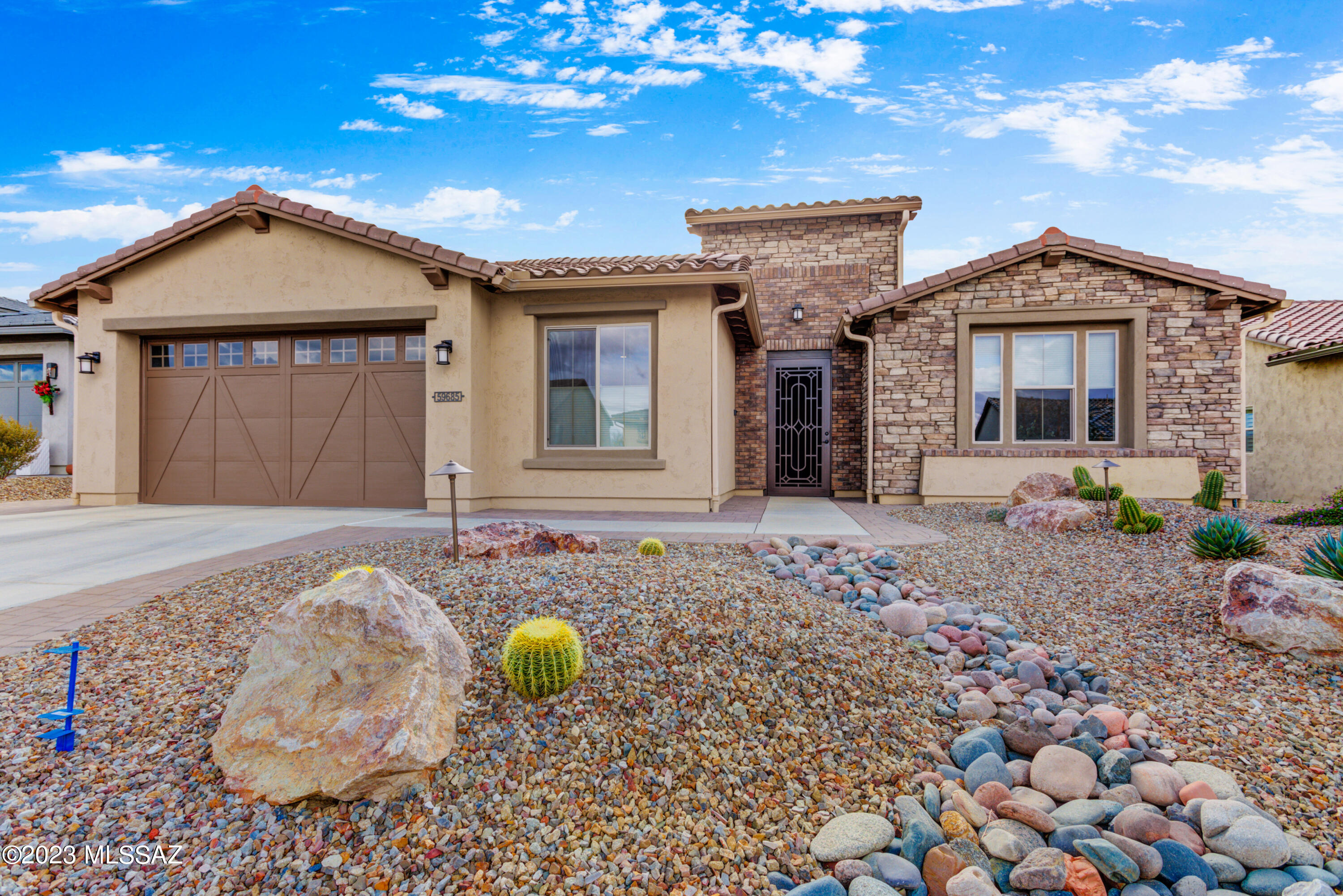 Views of the Catalina's, Tortolito's and Hole #15 just don't end on this 2674 sq. ft. Vienta Elevation C floor plan with a large Hobby Room and large extended Garage for your Golf Cart.  This Premiere Series home has 2 Bdrm Suites and 2 Baths plus Powder Room; both Bdrms have Walk-in Closets.  The primary Bath has a 42'' X 60'' Shower and built-in Seats.  The chef's Kitchen has Quartz counters; a Walk-in Pantry; Gas Cooktop; and a true Entertainer's Kitchen Island.  Off the kitchen is the large Great Room featuring a Media Alcove.  The Dining area is perfect for your entertainment needs.  The spacious Den can be used as a 3rd Bdrm for guests.  All rooms feature 9', 10' & 11' ceiling heights to make the house feel even more roomy.  Patio has 378 sq. ft. of Covered Living Space that look south down the fairway toward the mountains.  This home leaves little to be desired.  Begin or continue your Arizona experience in the perfect home.