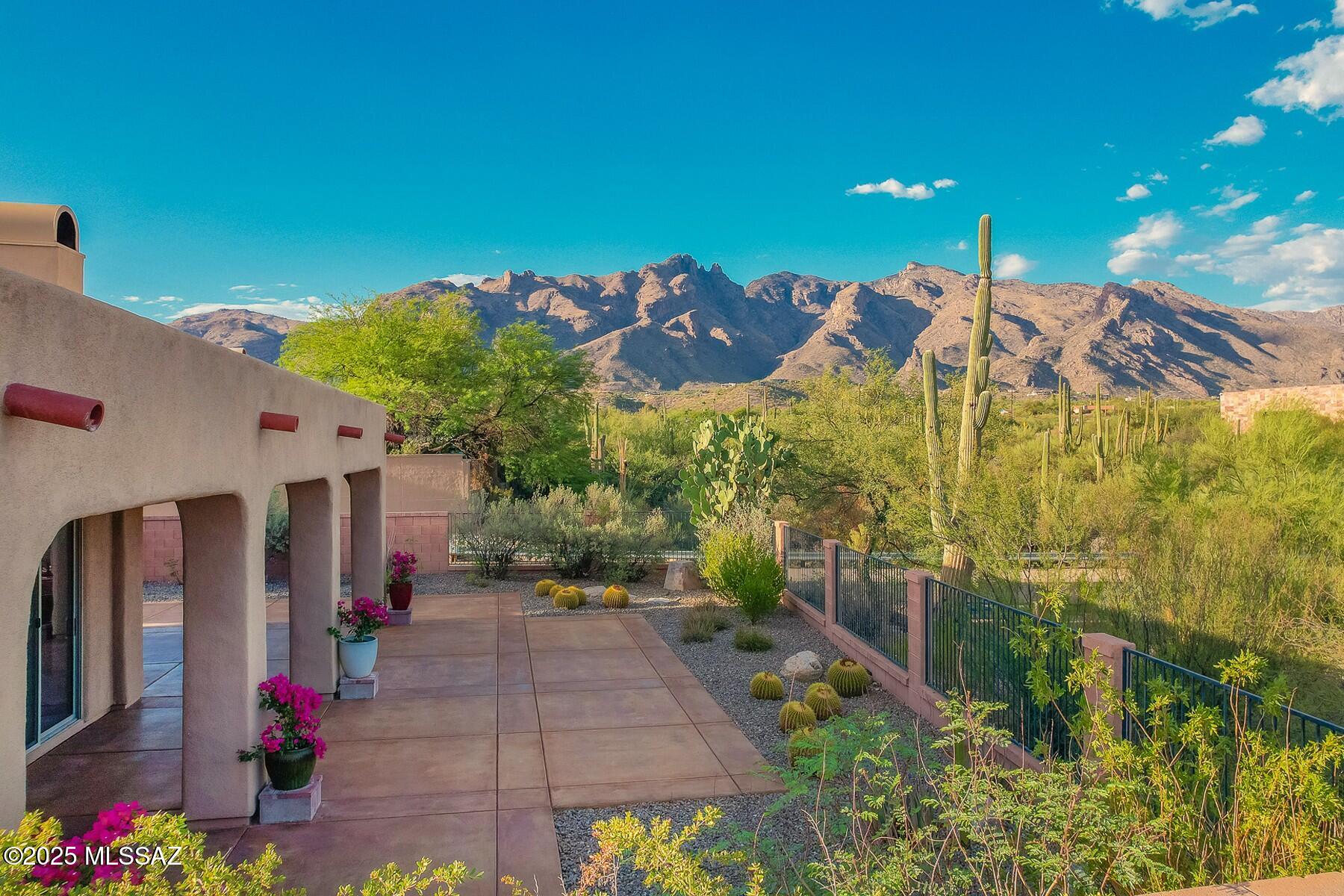 Located in the prestigious guarded and gated Villages of La Paloma, this 4-bedroom turn-key property sits on a premium, elevated corner lot. This serene setting promotes active, low-maintenance lifestyles w/ nearby premium shopping, dining, golf, tennis & hiking. Perched above a lush desert valley with unobstructed Catalina Mountain views. Inviting backyard w/ generous covered patio. The interior features warm Southwestern tones, elegant upgraded cabinets, granite countertops, tile flooring throughout & freshly painted interior. Split primary suite layout. Great Room concept w/ open kitchen & breakfast bar. Recent updates include new HVAC, washer, dryer, fridge & dishwasher. The Villages of La Paloma feature a gorgeous Community Pool & Spa & lovely rolling hills for that evening stroll.