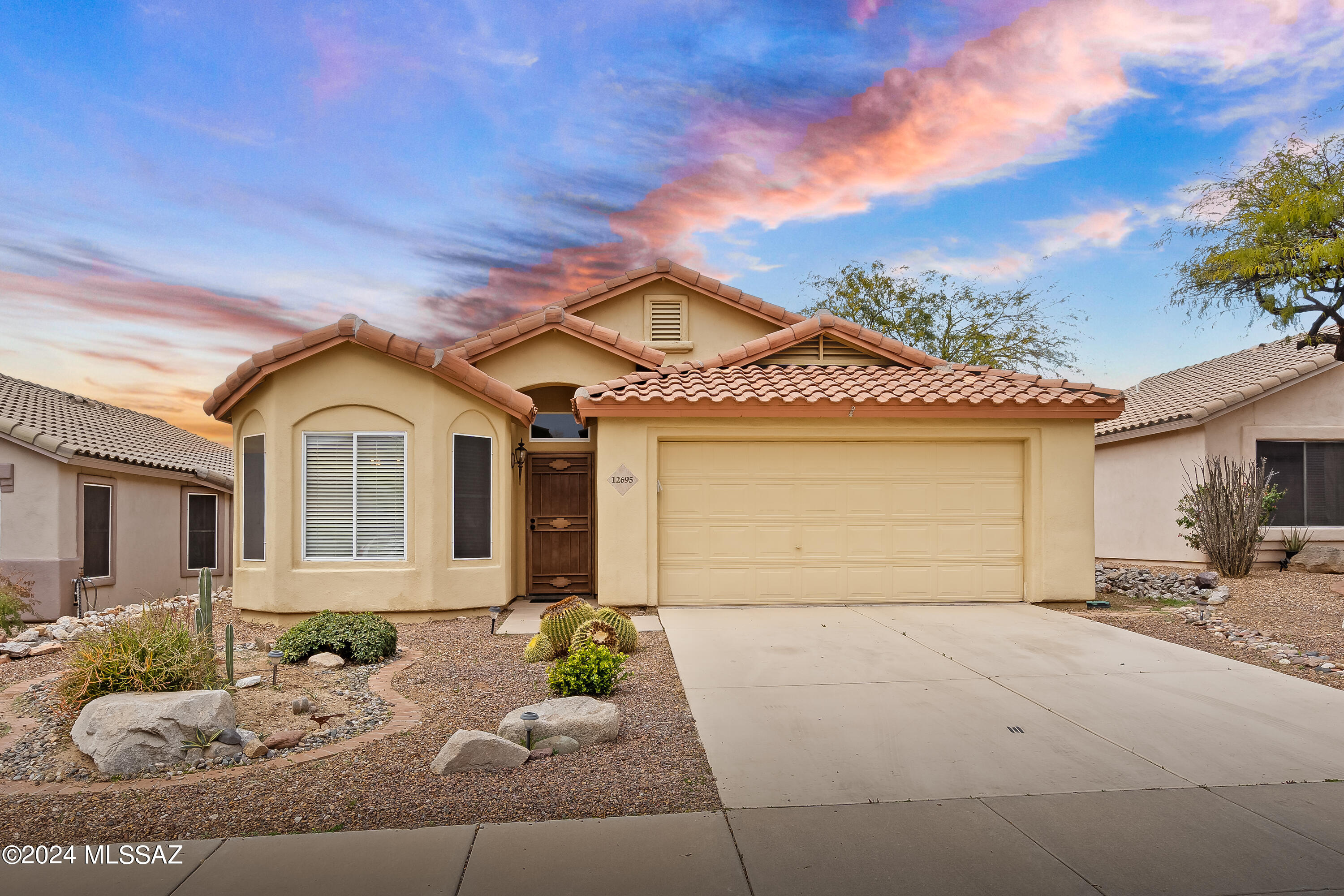 Welcome to this stunning 3 bedroom, 2 bathroom retreat in the coveted Dove Mountain community! With 1631 square feet of living space, this beautifully upgraded home boasts wood and tile floors, creating a warm and inviting atmosphere. The sunrise and sunset views are simply breathtaking. Unwind in the serene backyard oasis, featuring a sparkling pool and picturesque vistas. Additional amenities include a 2-car garage, tasteful upgrades throughout, and meticulous maintenance, making this property a true gem. Don't miss out on this incredible opportunity to own a piece of desert paradise!