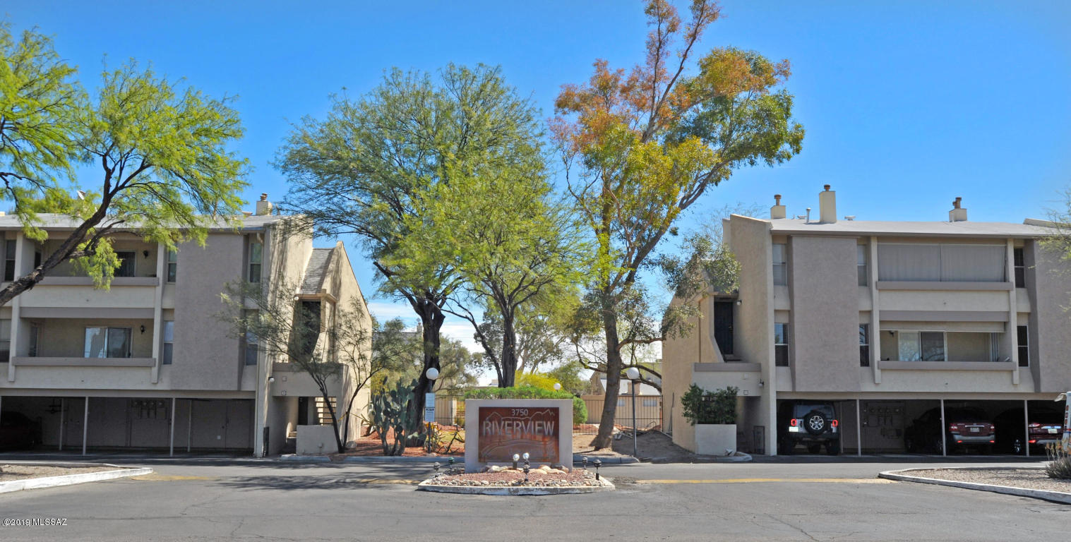 Move in ready, 1,236 SqFt two bed/two bath+Den townhouse style condo in desirable Central Tucson. Convenient location for U of A/Banner Medical students/staff, walk to Racquet & Fitness Club & River walk. Maintained grounds include walking paths & refreshing pool. HOA includes water, pool, termite, roof, hazard insurance, exterior maintenance & rentals allowed. Home has a split plan w/second bed+bath upstairs, ideal for student/roommates or downsized low maintenance living. High ceiling in the living room with fireplace & view of the grounds/pool with no neighbors above. Recently replace HVAC and water heater, all appliances included. Come see for yourself today, not a lot of move in ready inventory available in this price range.