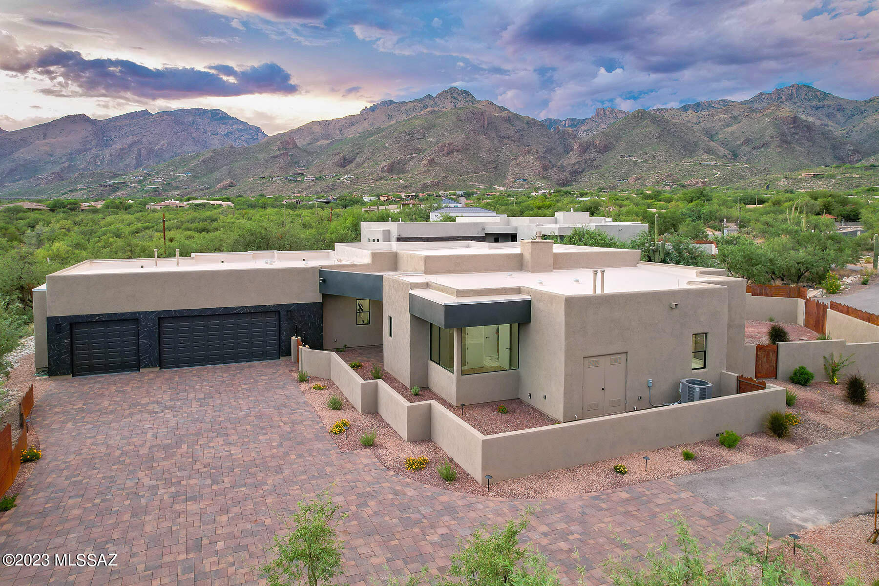 Sophisticated new southwest contemporary designed by Greg Simmons & crafted by Al LeCocq. The private 1.95 acre lot is within walking distance to Sabino Canyon, schools and offers stunning mountain views! Magnificent home for discerning buyers who truly understand quality in workmanship. Spacious open, and bright great room floor plan w/soaring ceilings, floor to ceiling windows, 8' solid doors and gorgeous tile throughout. Gourmet island kitchen with beautiful high end cabinetry by Affinity Kitchens, top of the line SS appliances, built-in refrigerator, Quartz counters and large walk-in pantry. Spacious primary suite and 4 luxurious bathrooms. Enjoy the great outdoors in the north east facing rear yard with the expansive covered patios, built-in BBQ and stunning views! See more section. Please note photos in MLS are from a similar model with the same floor plan and similar amenities. New photos and 3D scan will be taken in a few weeks when the home is finished. See photo section for photo of Esperero Wash running after a summer monsoon.

Please use Agave Title, Kelly Ladrido Escrow Officer. 520-918-1683. Kellyl@agavetitle.com. 

Note new tax code is 114-05-011U. Title Commitment with legal description and links to CCR's are in attached documents.

Al LeCocq was SAHBA's Custom Home Builder of the Year award winner 2 times. LeCocq Custom Homes are built with engineered post tension slabs, fully sheathed plywood exterior walls, R-38 insulation in the ceilings, energy efficient windows and many other custom features.

There are 2 access gates. The 2nd gate (which is currently open) is for the 3 new luxury home community being built by LeCocq. There is no HOA however there are recorded gate and road maintenance agreements that currently total approx. $122 per month. There will be additional fees required for the LeCocq community shared road and gate maintenance.