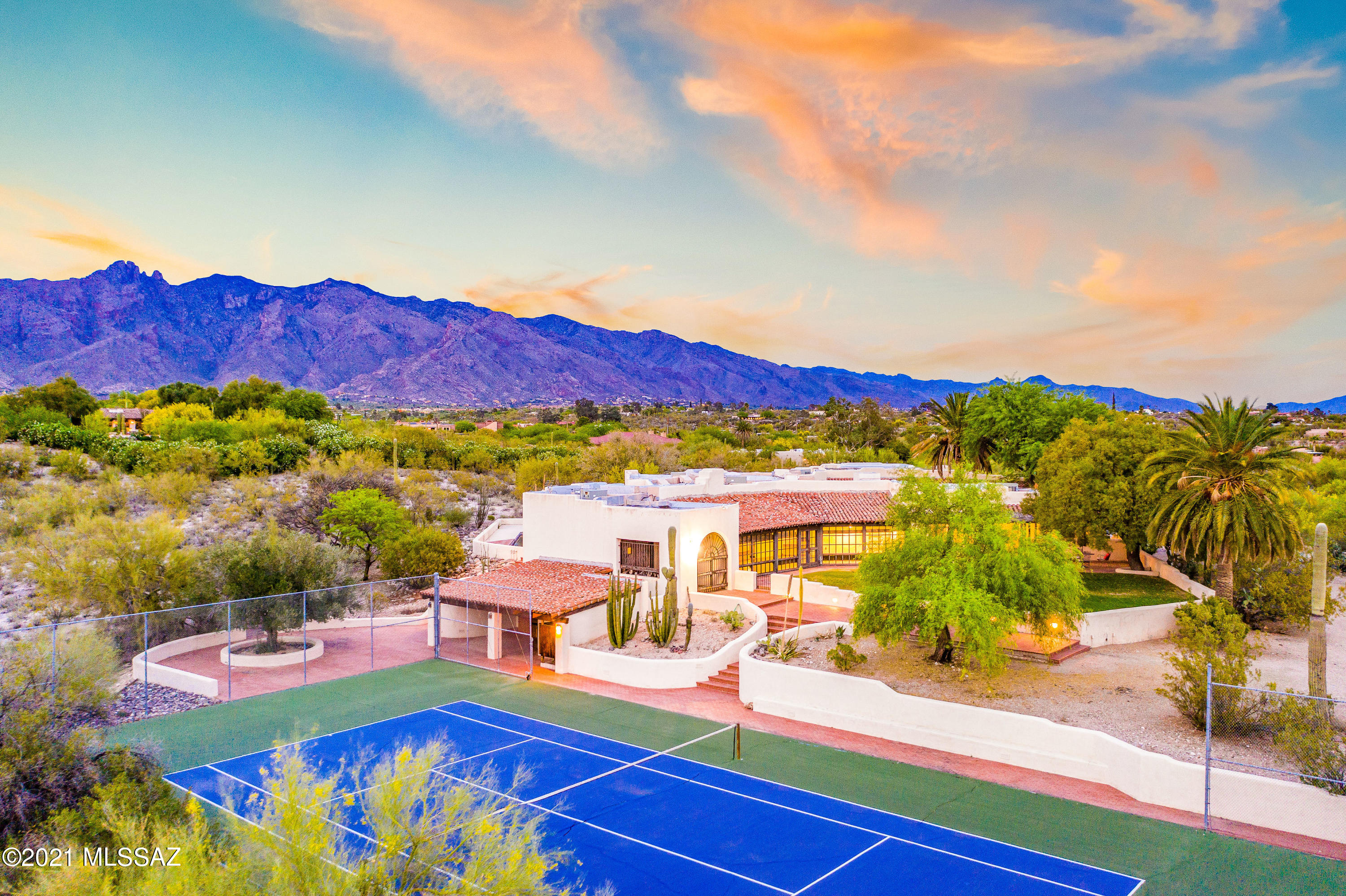 Steeped in rich history, this sprawling 5.32 acre Joesler Estate w/ city, moutain and sunset views emanates opportunity w/ it's extraordinary Old Foothills location perfectly situated between the University of Arizona & La Encantada mall right off Campbell Avenue.  Experience the ultimate privacy & views w/ incredible proximity.  This 7200 sf residence w/ guest house, huge bonus room w/ bathroom, tennis court and pool belonged to famous actor Lee Marvin & U. S. Representative Mo Udall. Built in 1936, this exquisite Tucson home has all of the trademarks of a quintessential Joesler-Mud adobe construction built around an expansive courtyard w/ a huge fountain, beamed ceilings, 4 fireplaces, mission tile porches w/ chinked mortar & scored concrete floors. Room to build on this  oversized lot. Six Bedrooms and Seven Bathrooms. Buyer to verify any lot split or development potential independently. Ask about adjacent parcel 1.99 acre tax id 108-15-048V