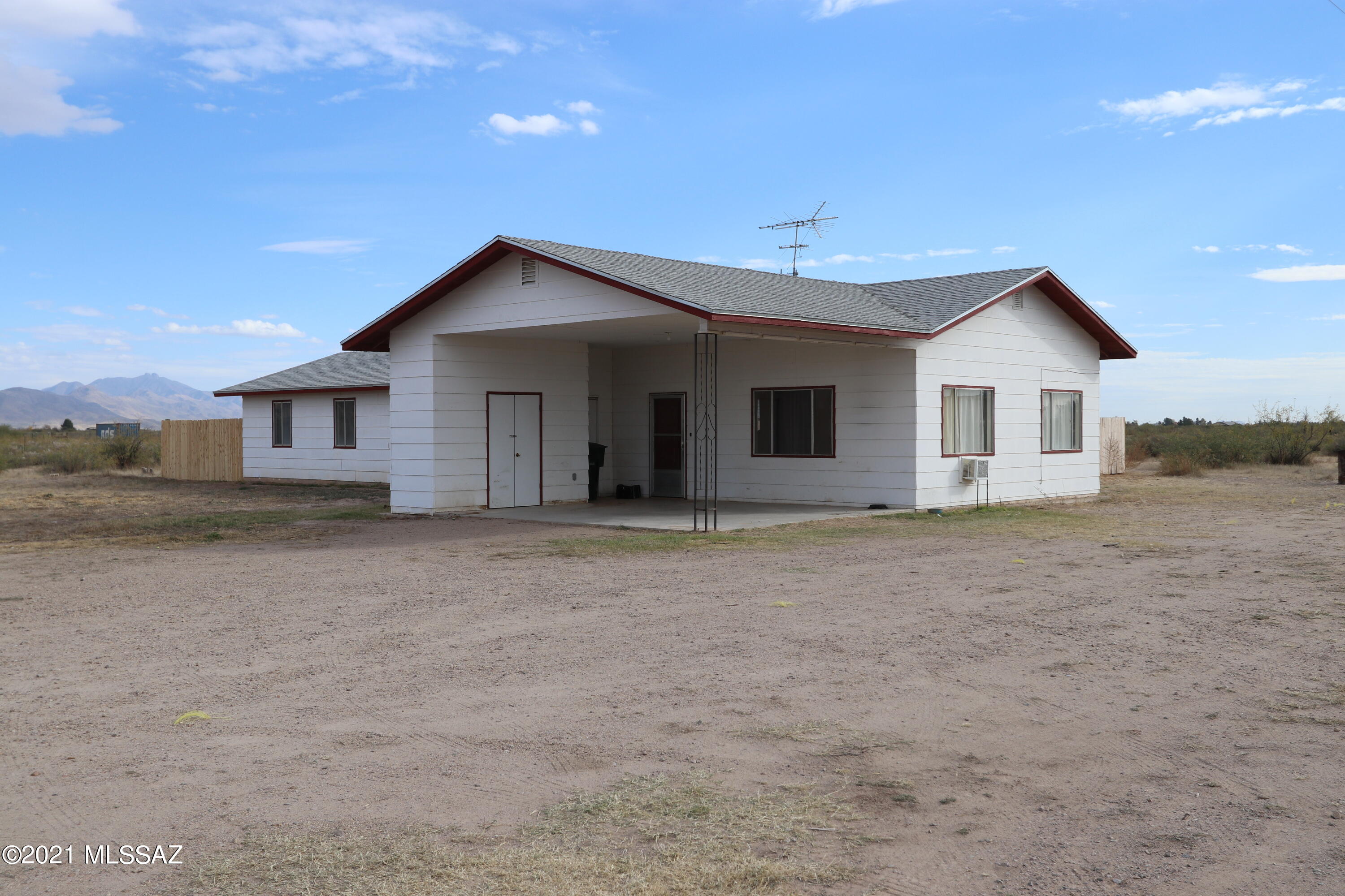 Ranch style House on 10 (10.93) acres offered in Willcox AZ. Near Tucson. 3 bedrooms,  2 baths.  Modern Kitchen, new floors. Great family room with fireplace. Family ready fenced in back yard. Horses welcome in fenced corral.  Enjoy country living while being 10 minutes to shopping, movies and schools. Have fun in the fall at You pick farms just 5 minutes from home. Willcox has an AVA (American Viticulture Area) with many wineries and vineyards. The area is known for its climate and soil and compared to wine grape areas of France and Italy. Willcox has festivals, parades and rodeos throughout the year. Willcox is a 1 hour drive to Tucson, Bisbee and Tombstone, AZ. Good schools, good climate and mountains. Hike, bike and camp nearby.