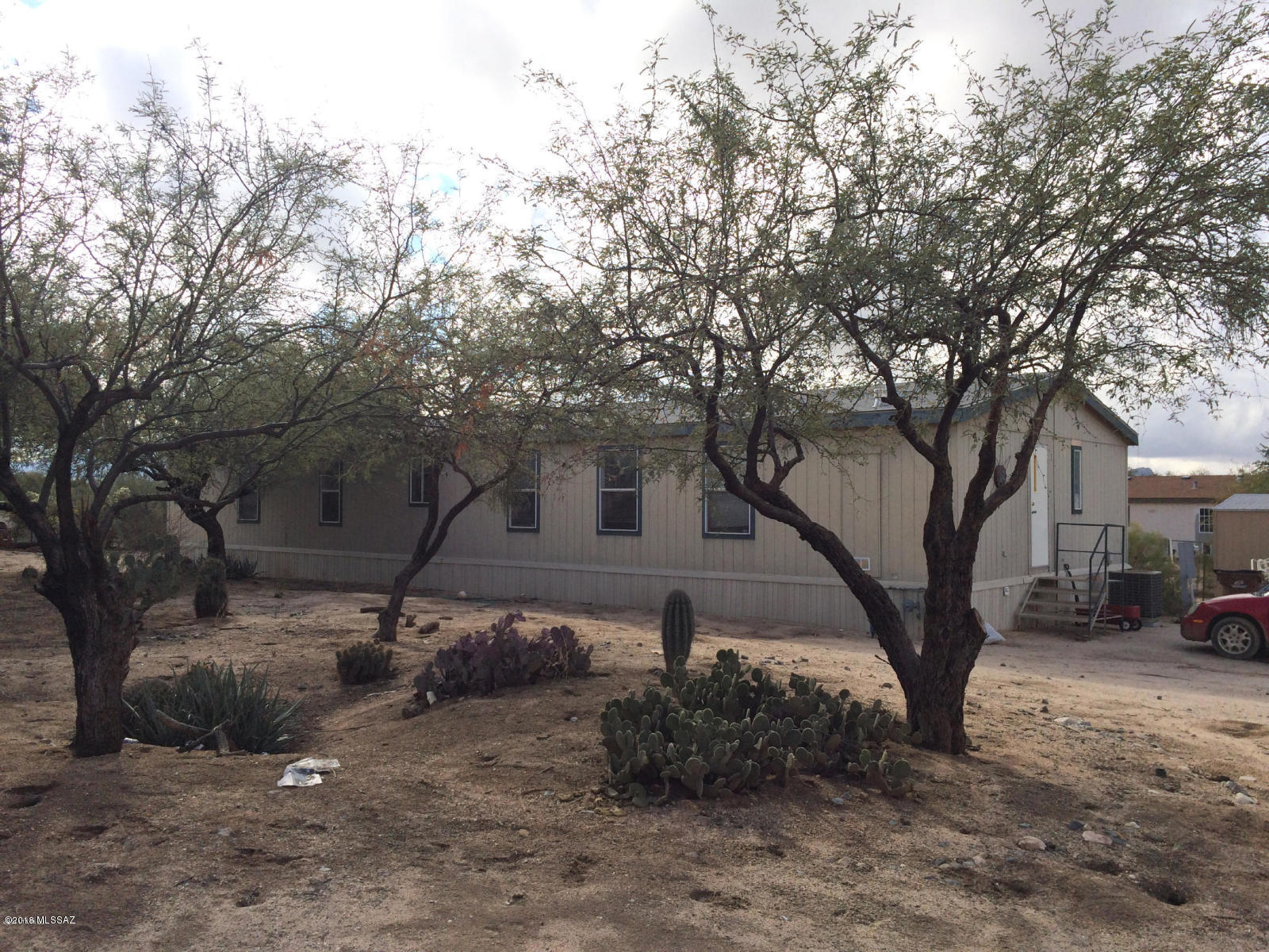 Two manufactured homes on 1.14 acre horse property. One home has 3 bedrooms, 3 baths, 1848 sq. ft., split bedroom plan, formal living/dining room with fireplace in living room. Built in 2001. Awnings are on both front & back.  Block skirting. 2nd manufactured home is not affixed, 5 bedrooms, 3 full baths, and approx. 2007 sq. ft., built in 2003. 
Two septic tanks. Shared well.