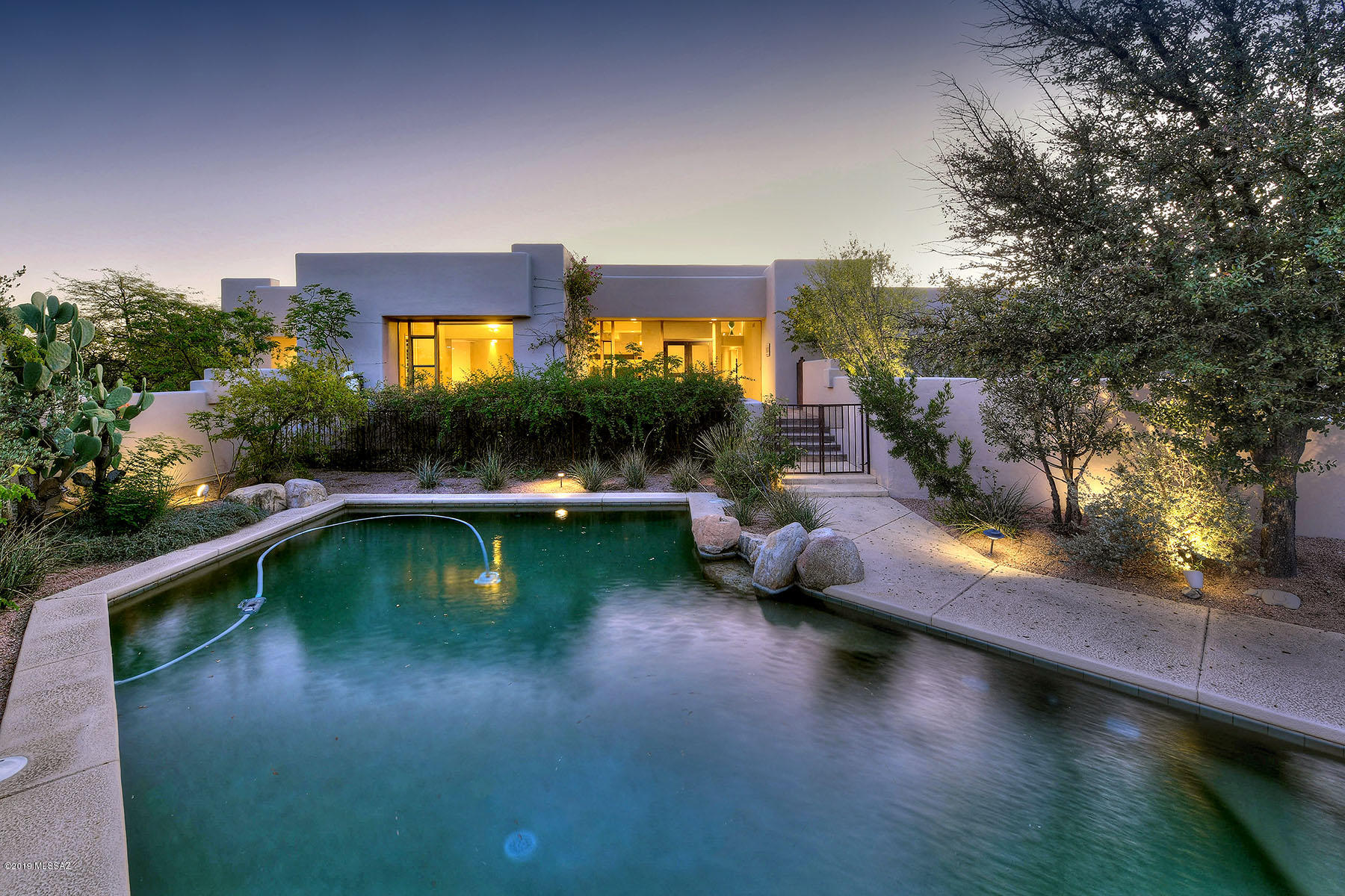 Beautiful custom foothills home in the exclusive gated Catalina Foothills 10. Updated throughly. Many built-ins. Beautiful Mexican flooring. Great indoor/outdoor living.