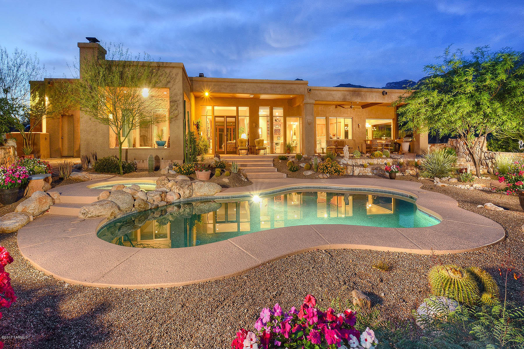 Soft contemporary with gorgeous mountain vistas and stunning city lights in prestigious Pima Canyon Estates. This well cared for home features an upgraded kitchen w/double ovens & granite counters, lovely breakfast area w/mountain views and opens to spacious family room w/wet bar. Comfortable living room has Cantera fireplace & doors that open up to the extended covered patio, great for entertaining.Trendy wood floors and classic travertine through out. Private master retreat & covered patio off master w/fireplace are new additions, perfect for relaxing & lounging. Large master bath has steam shower & Jacuzzi tub. Guest br 5 has it's own entrance, great for guest quarters or in laws. Br 4 is set up as home office. Extra features include ample storage inside and generous 3 car garage.