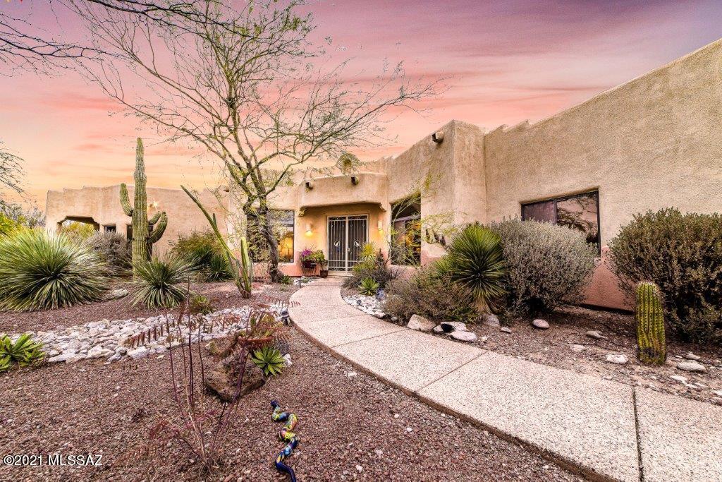 This Foothills home is located in a serene, gated community offering 4 bedrooms, 3 bathrooms, a pebble-tec pool PLUS breathtaking Catalina Mtn views! This home has everything you've been looking for! The gourmet kitchen features double ovens, granite countertops and a large island. Off the kitchen is a breakfast nook with large windows showcasing the beautiful Catalinas. A perfect place for your morning coffee! Relax in the spacious living room in front of the gas fireplace or enjoy dinner parties in the formal dining area. This home was built for entertaining! The master suite has its own private patio, walk-in shower and jetted tub. Take a dip in the pebble-tec pool during hot summer days in your private backyard oasis.  Come make this gorgeous house, your new home! Other features of the home include: Multi-Room audio sound system,  murphy bed in guest bedroom/office, tray ceiling in living room, built-in closet system in master bedroom, electric awning on back patio plus so much more!