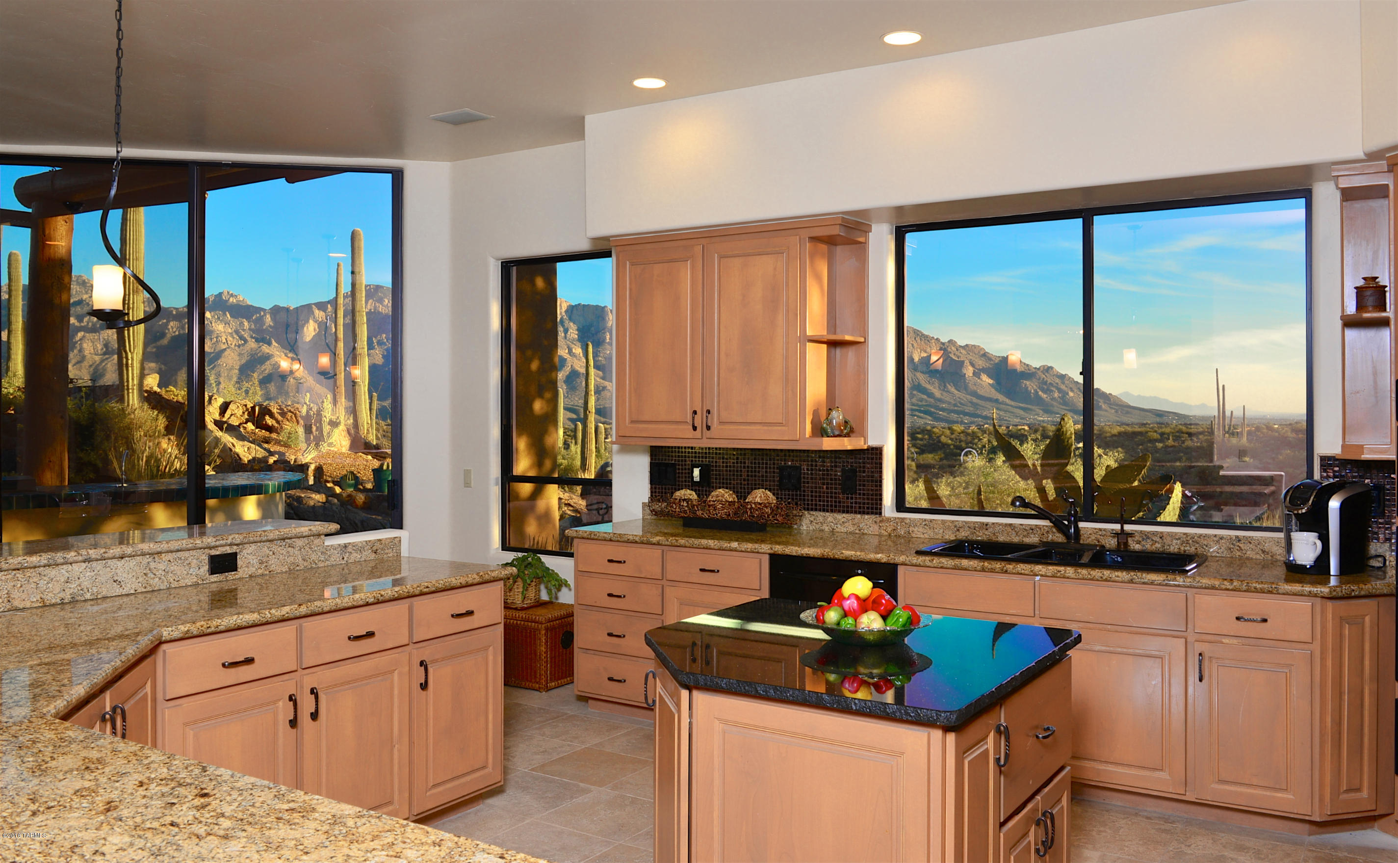 Unobstructed panoramic views of the majestic Catalinas and distant city lights from high promontory setting among rock outcroppings and saguaros in Rancho Vistoso’s luxury gated Honey Bee Canyon Estates! Inviting SW design with courtyard, stone floors, wood beams, high ceilings, open spaces and an abundance of windows showcasing views from all main rooms. Custom 3,673 SF residence: 3BD, 4BA, den/office, formal dining, wetbar, chef’s kitchen, 5 Fpls and finished 3-car garage.  Spacious patio areas w/built-in BBQ bar, automated awnings, misters, water feature and private side yard w/wood-burning fireplace, exercise pool, putting green, and top-of-the-world spa retreat from which to enjoy the star-studded sky. Perfect for entertaining or relaxing & enjoying sensational views! OPEN Sat & S