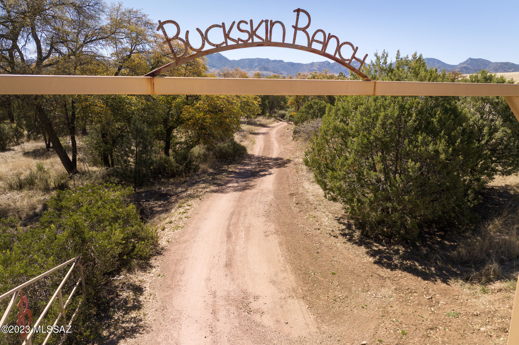 Step back and discover the pleasures of the  Buckskin Ranch in Willcox, AZ. Built in the early 1900s this beautiful secluded 160 acre ranch is nestled in the Galiuros Mountains of Southern Arizona and bordered on three sides by the Coronado National Forest. Originally built as a western dude ranch, the property offers a main lodge with fully equipped commercial kitchen, living and dining rooms, plus a western bar. The furnished adobe casita combines rustic charm and comfort with dramatic mountain views. At 5,000 feet, the Buckskin has a comfortable climate for enjoying a multitude of activities. Ranch includes horse barn and paddocks, state-of-the-art workshop, free standing laundry facilities and a caretakers cabin. MORE Dick Calkins, creator of the Buck Rodgers comic strips of the late 1920s built a cabin on the Buckskin, then owned by WWII pilot, Buzz Higley. Some of Calkin's best work during his cowpoke period was graffiti, several of which still adorn the walls of the Buckskin  Ranch House. Frank Tinker wrote: One graffiti depicts a single tooth saddle bum: you go into the bathroom see and get settled. Then you realize that you are not alone. Startled, your eyes lift to the wall opposite which in the architectural customs of the country here about is about five feet hither. Here, fixing you with a licentious leer, is a scrofulous rounder brandishing a large scrub brush-"Don't git up", he's saying. "I only come in to brush my tooth." The Buckskin Ranch lives on. One of a kind!