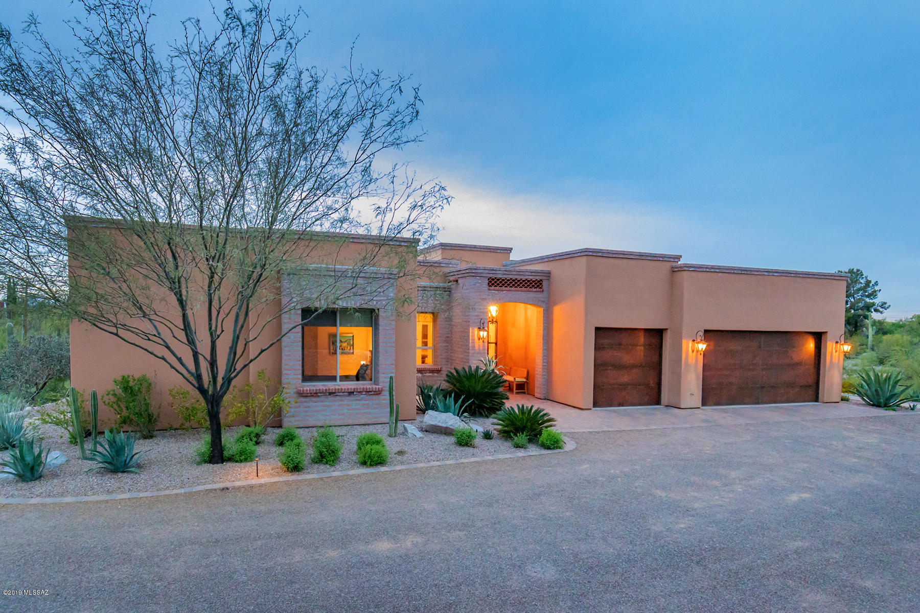 Outstanding 2014 custom built territorial home sited on private lot in the heart of the Old Catalina Foothills. This 3468 Sq. Ft. home embraces the Southern Arizona lifestyle featuring a split plan with 4 Bedrooms, 3 1/2 bath, 8' Alder doors, Travertine floors, foyer w/beamed & corbel ceiling & open concept floor plan. Gourmet kitchen w/granite counters & SS appliances opens to living & family room w/masonry fireplace. Entertain in resort style backyard, w/custom pool, built-in BBQ, masonry/wrought iron walled backyard, professional landscaping & extended covered patio w/tongue and groove ceiling. Master ensuite showcases two custom built walk-in closets, soaking tub, oversized walk-in shower & private entrance to backyard