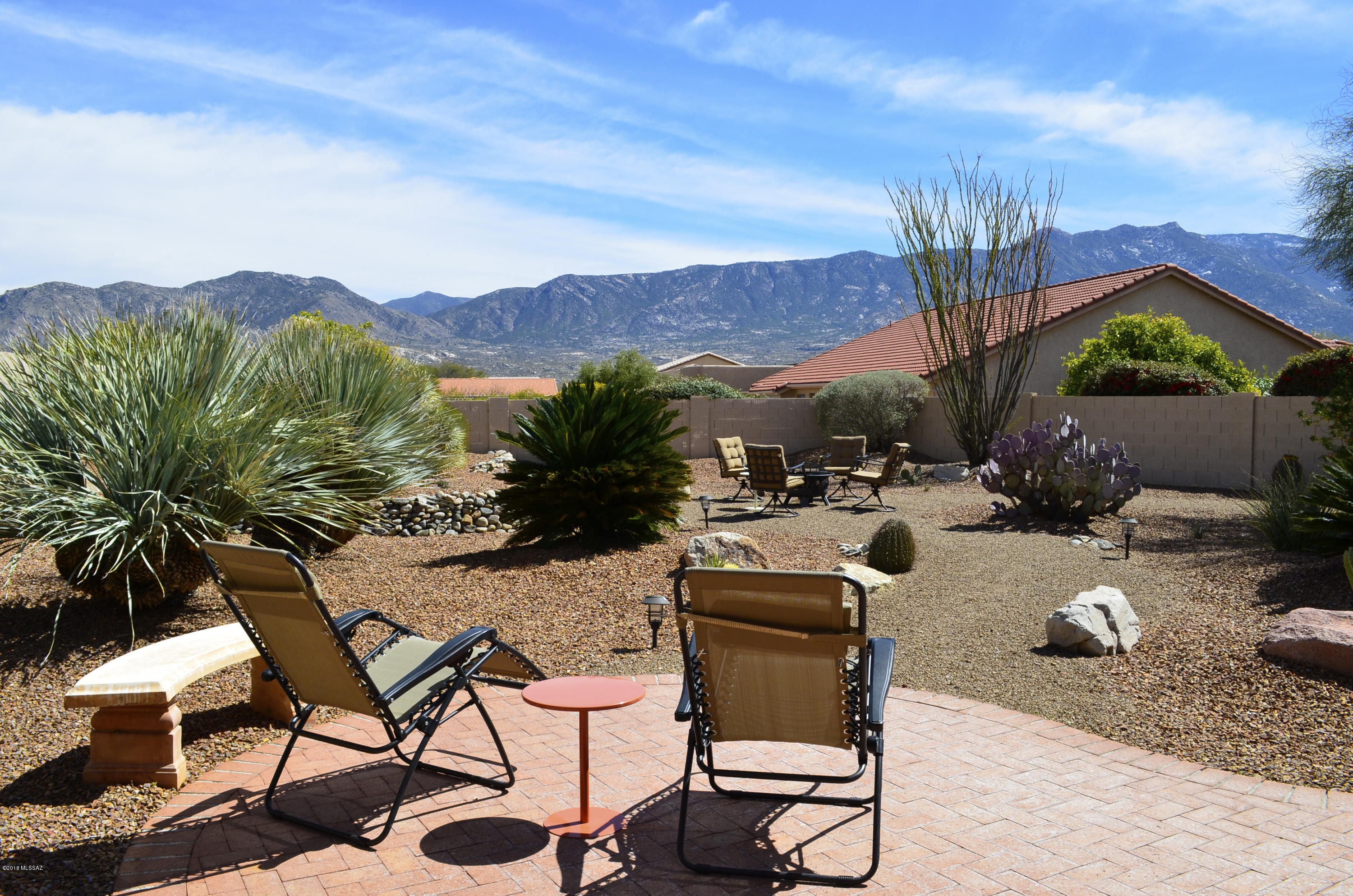 Private Lariat (Sedona) Model with a Contemporary Décor and Sweeping Catalina Mountain Views from Inside & Out. The Open Great Room Design, Vaulted Ceilings & Plentiful Windows Create a Light & Airy Ambiance. Kitchen with Slab Granite Counters, Center Island, Walk-in Pantry, Breakfast Bar & Gas Range. Sunny Breakfast Nook. Dining Area Accommodates a Large Table for Entertaining.  Spacious Master Suite with Office or Sitting Room. Sleek Master Bath with Double Sink Vanity, Walk-in Closet & Shower with Custom Tile Surround. Comfortable Guest Room & Updated Guest Bath. Den & Laundry Room with Cabinets Plus a Separate Office. Private Outdoor Living Space with Shady Covered Porch, Extended Brick Paver Patio, Built-in BBQ Grill, Impeccable Landscaping. Meticulous Move-in Condition.