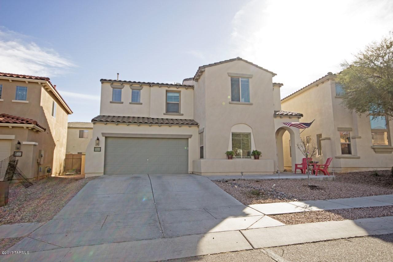 Approved short sale. Very well appointed, lovingly maintained & upgraded Pulte Toledo model boasts custom colors, wood floors in liv./family rooms, light oak cabinets, pantry, 5 burner gas stove in kitchen. Paneled doors throughout, hard wired fans, too!  Downstairs bold red powder room w/pedestal sink, wainscoting. Upstairs laundry w/extra storage cabs. Very large BR's! Master bath with cultured marble and tiled shower surrounds, hall bath with double vanities. More: wrought iron security door, dry bar in living room, pass thru from kitchen to dining. Now for the outside: Entertainers rear yard with 3 patio areas, privacy block wall. Community amenities are superior! Facilities are second to none