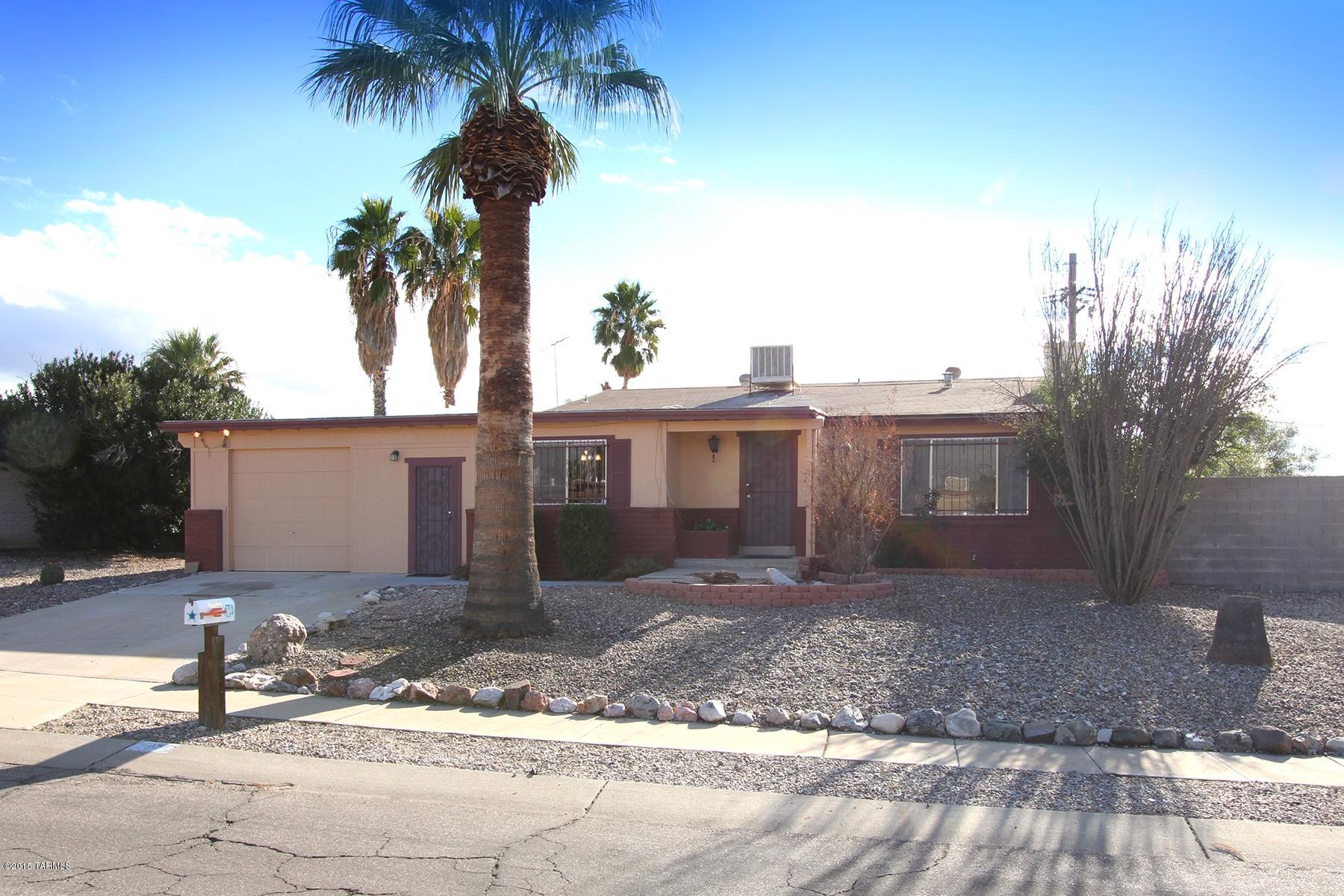 If you need room to grow or space to spread out, this charming east side split-level house has it all for you. There plenty of space here. This 4 bedroom 2 bath home is not only spacious but is conveniently located just minutes from shopping and dining. The eat-in kitchen has tons of cabinet space and counter space with a generous island and has been tastefully updated with courts counters. The mountain views  out the dining area window provide a beautiful background as you enjoy diner. The bee-hive fire place in the cozy family room invites everyone to relax together. Upstairs, is the large and airy master bedroom and another sizeable bedroom. Down stairs are two more large rooms. There is really room for the whole family here.  The back yard is tranquil with lots of greenery. There is plenty of patio space and of course the sparkling pool that invites family and friends to take a dip. A large home with many extras. Come see before it is gone. Move-in condition.