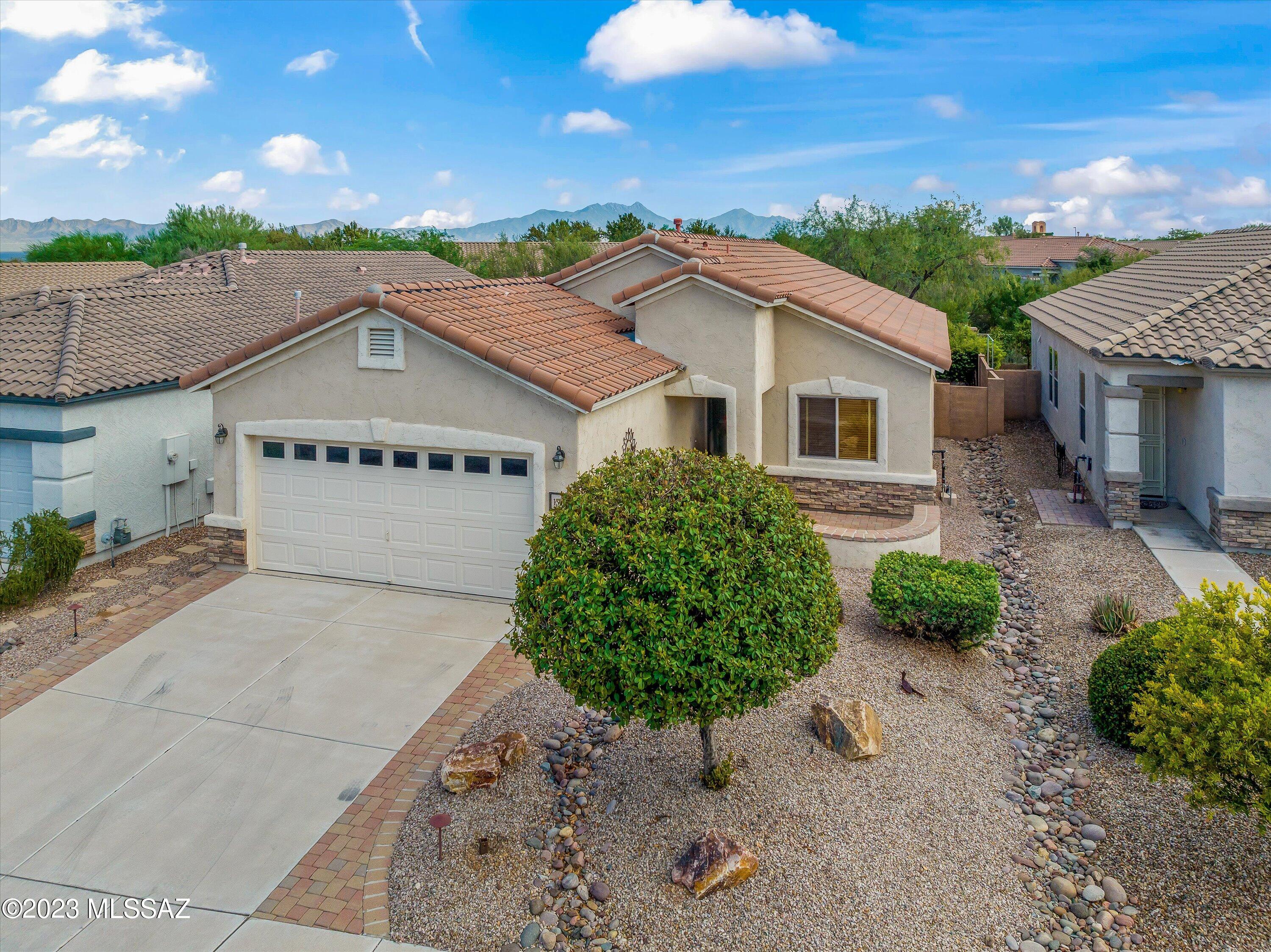 Welcome to Rancho Resort! This beautiful 55+ community is easily accessible to I19, shopping, grocery stores, restaurants, hospitals, etc. When entering the gated community you will be greeted with rolling hills of grass, tennis/ pickle ball courts, Volleyball Courts, Pool and Club house. The 1500sqft home has only had 1 owner, never been on MLS before. It contains 2 bedrooms plus Den/office, 2 full bathrooms with Cultured Marble Countertops and Showers. The Kitchen has Granite Countertops, oak cabinets, black appliances and an oversized nook/dining area. 2 Car garage with Storage. Large Master Suite with walk-in closet overlooks the private back yard that is completely paved and landscaped. Front yard has a great spot for enjoying some coffee in the morning! Come check out this house
