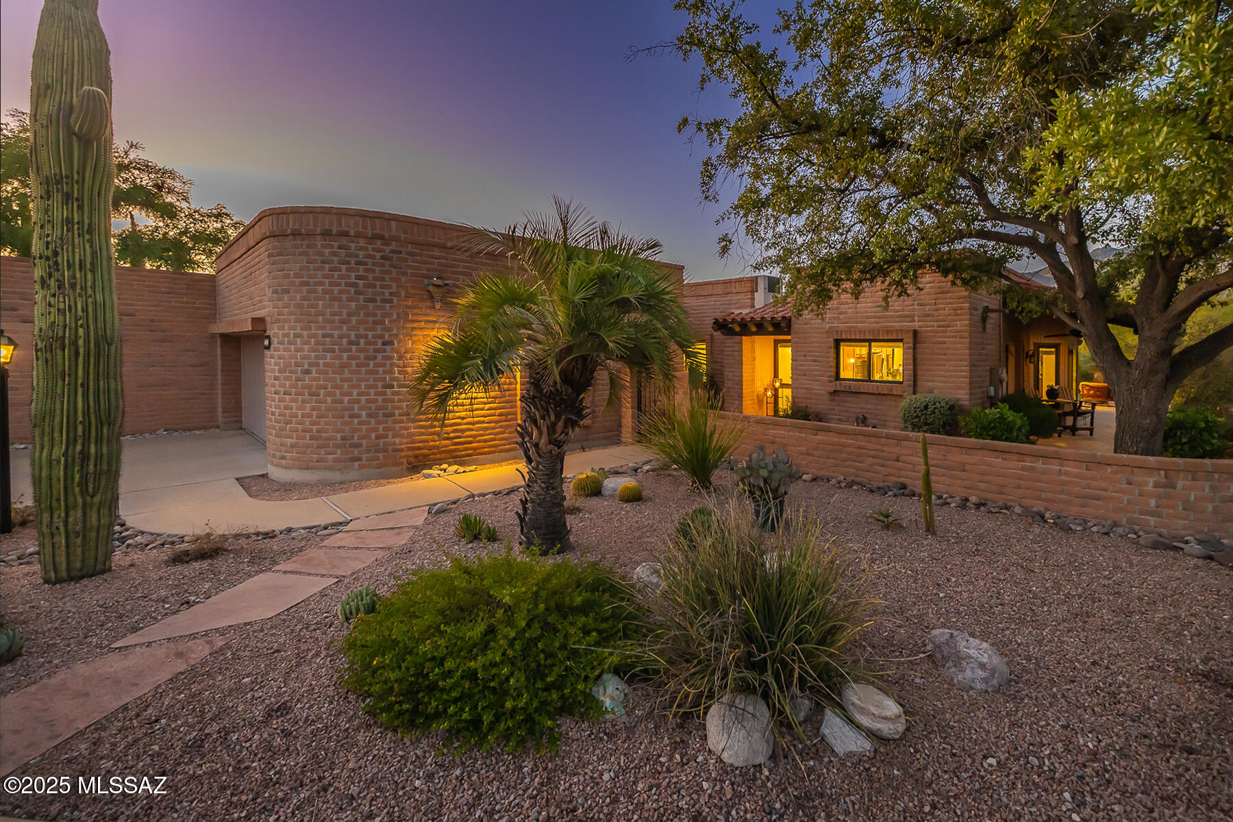 Beautifully remodeled and thoughtfully redesigned, this 2,001-square-foot home offers inviting indoor and outdoor living with refined contemporary finishes throughout. The spacious living room features a striking custom fireplace wall and dual sliding glass doors that open to a beautifully landscaped patio with Catalina Mountain views, perfect for relaxing or entertaining.

The bright, open kitchen includes raised ceilings, custom cherry cabinetry, quartz countertops, a designer backsplash, stainless steel appliances including a gas range, and a built-in coffee and wine bar.

The primary suite enjoys serene mountain views, dual closets, and a luxurious bath with executive-height cabinetry, a large walk-in shower, and a private water closet. The guest bath has been fully updated with new tile, fixtures, and lighting, while the den provides a versatile space for work or relaxation.

The backyard showcases stunning mountain views and has been completely redesigned with professional landscaping and a new irrigation system, creating a tranquil desert retreat ideal for outdoor enjoyment.