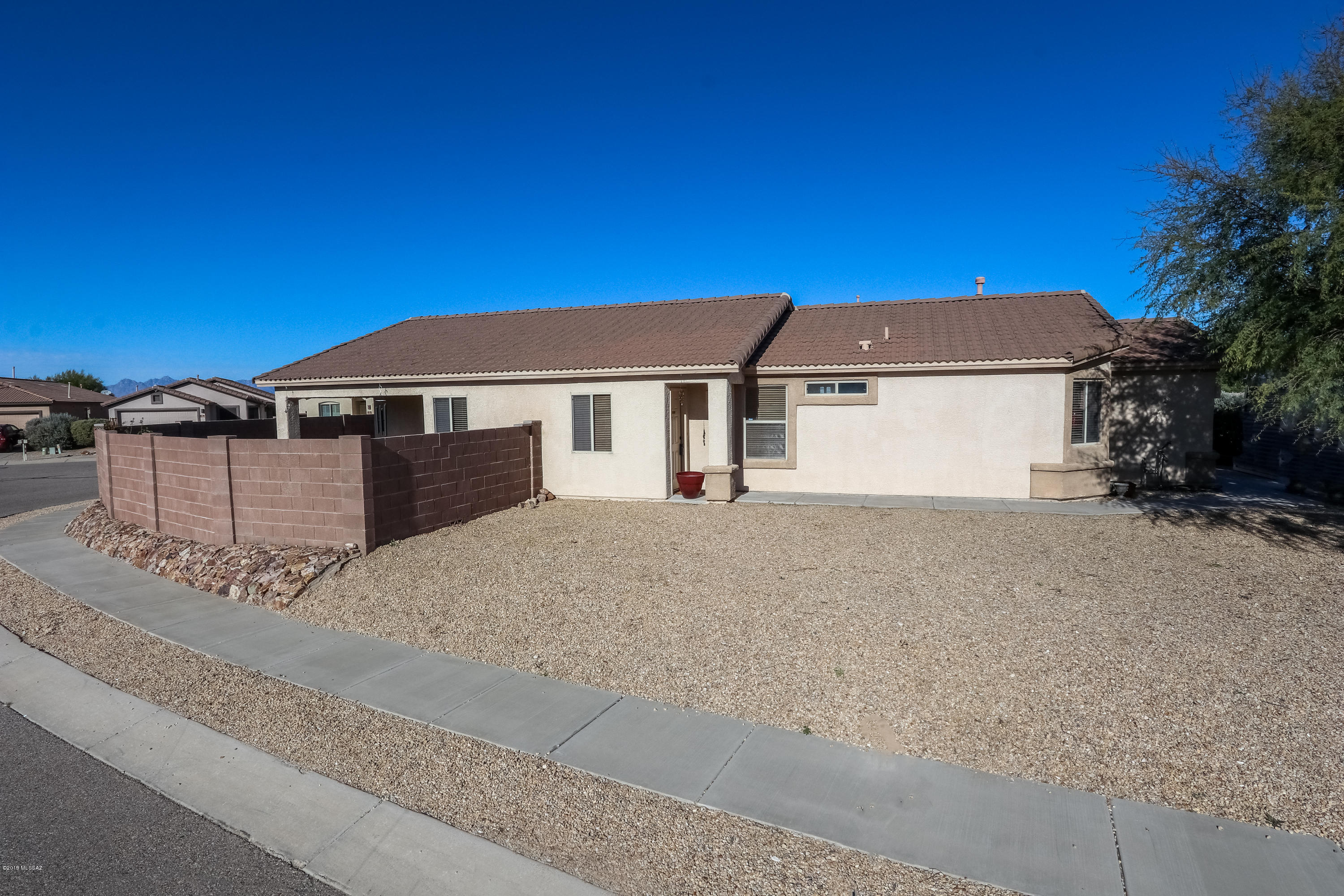 This home is in the award winning Vail School District. It's within walking distance to Cienega High School. This four bedroom, two bathroom home sits on a corner lot. The kitchen is newly remodeled with new cabinets,backsplash and granite counter tops. The great room has been tastefully redone with new ceramic tile. In addition to the remodeling, this home has the added feature of a whole house water softer system. This must see home has many extras that make it stand out. Come see this wonderful home today, it won't last!