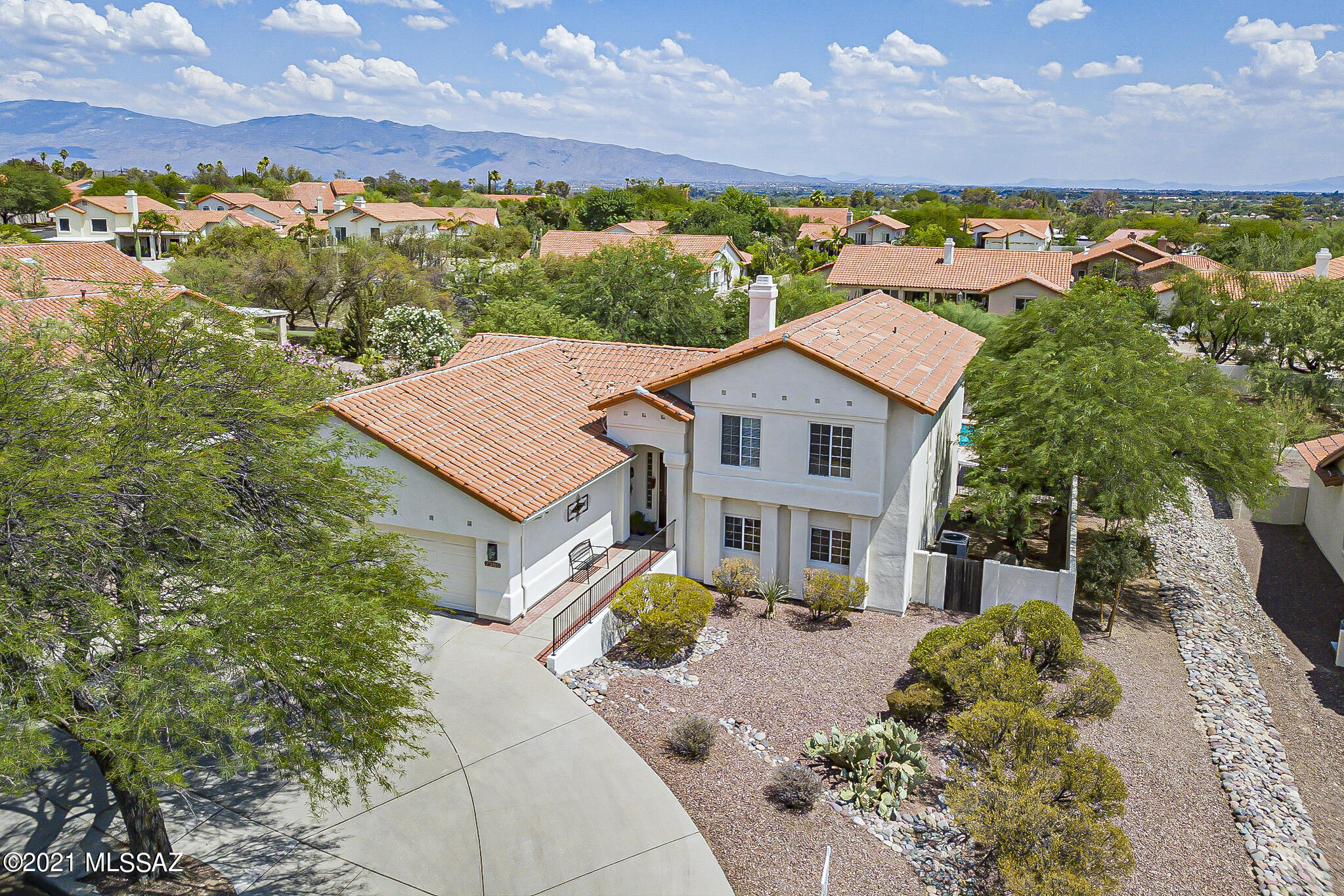It's not just the extended 3-car garage with a workshop along one wall and the incredible layout with multiple living spaces in this tri-level house.  It's not even the expanded kitchen or owner's suite with an updated spa-like bath. It's not the huge backyard with a lush lawn, covered seating areas, and a sparkling pool.  It's not the entertaining space, the chefs kitchen with custom cherry cabinetry or the hundreds of other lovingly cared for upgrades and amenities of this wonderful house.  It's the magic that happens when they all come together to be your next home.  It's when you have your loved ones over and there's space for everyone to mingle, or the relaxing time to enjoy the downstairs den after a long day, or the splashing in the pool with loved ones.  Come see it soon!