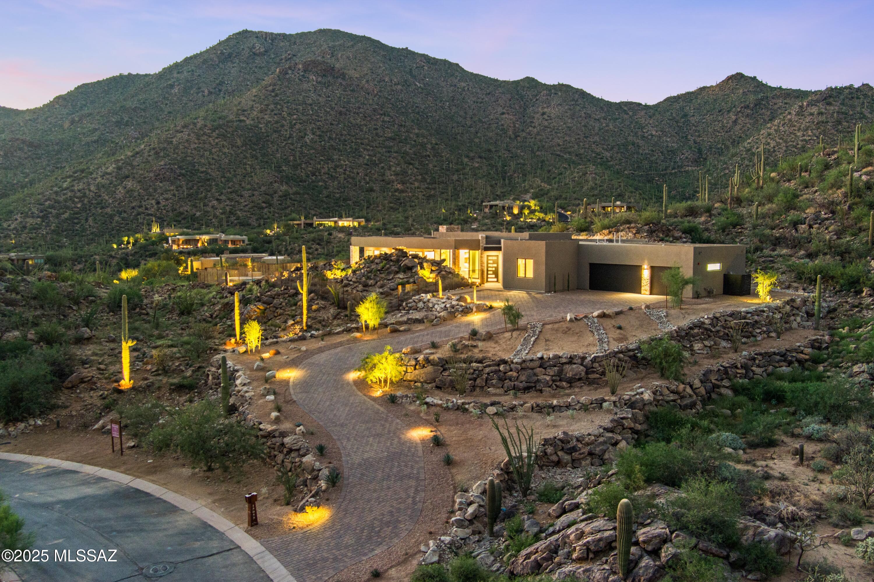 Beautiful, custom Kevin Howard designed home in the process of construction. Desert dwelling at its finest in the stunning and private Canyon Pass community. Find yourself with a bird's eye view of the canyon surrounded by the awe inspiring beauty of the desert.  Oversized windows in every room maximize sunrise and sunset views throughout your home with the desert landscape on full display all around you. Enjoy all tha Dove Mountain has to offer with the Gallery Golf Club and the Dove Mountain Golf Club just down the road as well as fine dining and services. Renderings are conceptional only. Buyer may choose other design options