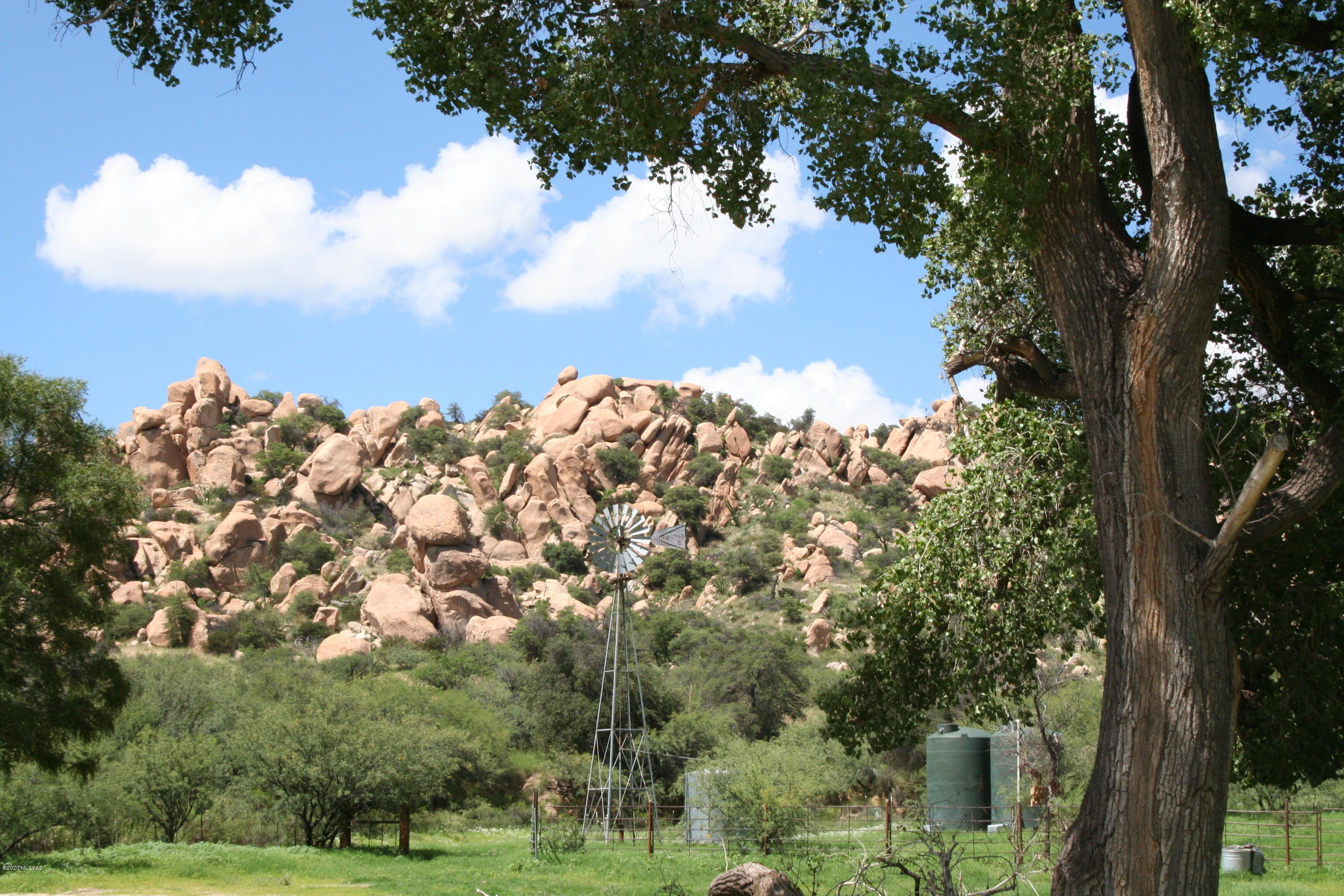 INCREDIBLE VALUE!! Truly a one-of-a kind ranch that is rarely, if ever available. There is nothing else like it in all of the southwestern United States. The ranch is located in the famed Texas Canyon in the Dragoon Mountains in southeast Arizona. It consists of 1,048 +/- deeded acres of diverse land highlighted by magnificent, massive boulder formations that are over 50 million years old. The ranch has electricity, well, and excellent access only 5 minutes to I-10 with good roads that wind through the spectacular canyons. It feels extremely remote and private yet it is only 45 minutes to the Tucson International Airport and 15 minutes to all services in Benson. The ranch has been featured in several Hollywood movies and television shows. Excellent annual climate at 5,000 feet The ranch has deep-rooted western and Native American history. The world renowned and respected Amerind Foundation borders the ranch. It also borders Arizona State Trust Land and BLM and there is a small lease included. The views are incredible in every direction and the land's phenomenal, dramatic beauty is breathtaking and truly humbling by its majestic stature. The ranch has unlimited potential with numerous possible uses. It is perfect for the ultimate legacy ranch for a family or a corporate retreat, wellness center and more. There are 2 small homes on the ranch which are perfect for a ranch foreman or temporary housing while you build your dream ranch estate. The 4Y Ranch is one of the American Southwest's greatest private treasures. I challenge you to find anything like this anywhere! 
Call for details and a private tour.