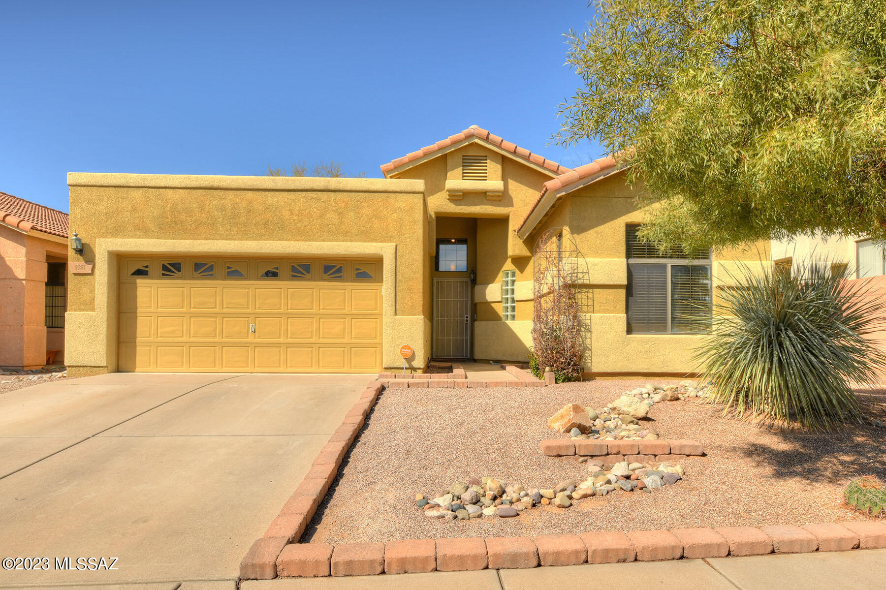 This is your chance to live in desirable NE Tucson. Catalina Point is a small subdivision near shopping, biking, McDonald Park, Agua Caliente Park & Mount Lemmon.  3 Bedrooms and 2 baths and a 2-car garage. Enjoy high ceilings and a split bedroom plan. Saltillo flooring in the common areas and wood laminate in the bedrooms. Primary bedroom has dual vanities and a new walk-in shower. Large kitchen is open to the dining room.  Lots of windows looking out to the backyard oasis where you'll spend all your time under the pergola and grilling on the built-in BBQ. Backyard has paver patios & always green turf areas.  Recent upgrades include Trane HVAC, water filtration system & Solar System installed in 2020 current monthly payment $88.00.