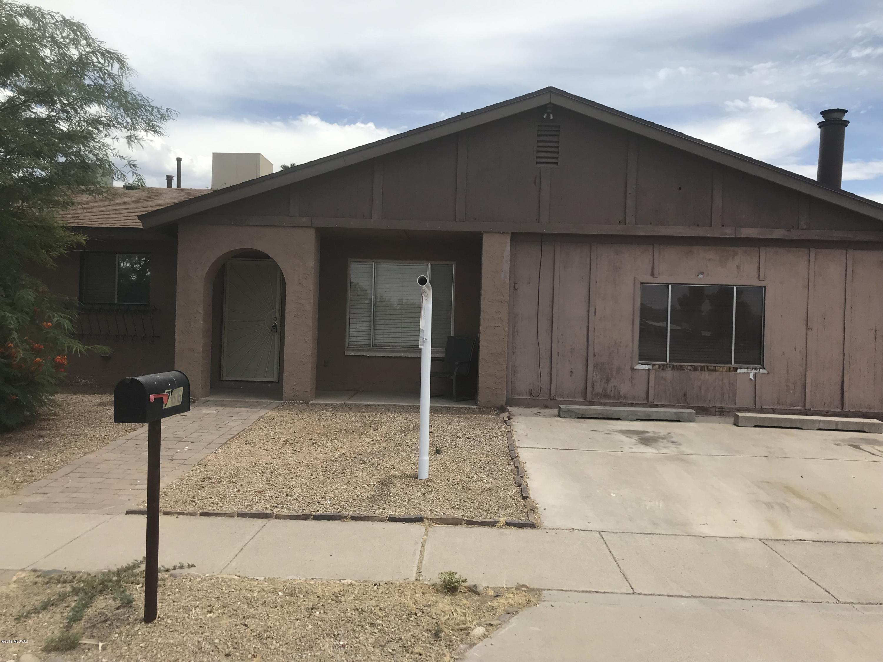 RARE FIND: Affordable 3 bedroom/2 bathroom in NW Tucson. DETACHED 2 CAR GARAGE/SHOP! Split bedroom plan, 2 bedrooms with walk in closets, wood-burning stove. Dual cooling. Large yard. Hurry!