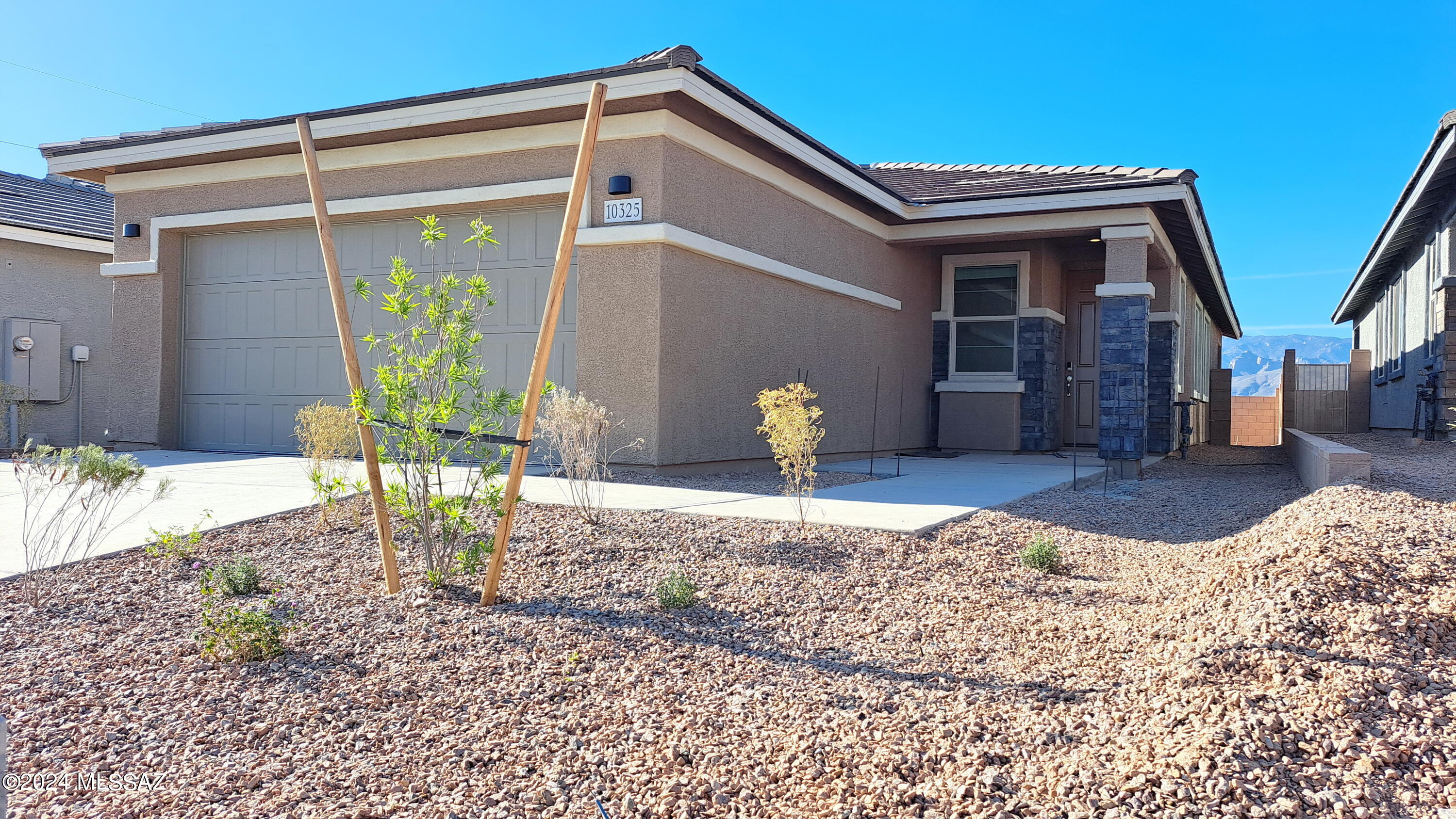 Gorgeous single-story home with 3 bedrooms plus a dedicated window office which has its own pleasing desert views over the south entry patio at the end of an unpopulated cul-de-sac. Superb island kitchen boasts tall upper cabinets, stylish designer lighting, dedicated espresso bar/refrigerator cove with new stainless steel Bespoke 31cf dual ice machine, and upgraded granite countertops throughout. Besides lots of storage, you'll also appreciate the large central dedicated laundry room. The office can be used as a den or a private space to work from home. This home is built with innovative, energy-efficient features to cut down on utility bills, including gas appliances, new 'smart' connected washer/dryer, 14+ SEER2 HVAC, quiet Low-E windows, and completely wrapped in the latest spray foam insulation. Spacious 2 car garage has provision for convenient electric vehicle charging.

This detached single family home has great curb appeal and it's all on a single level with no porch or entry steps more than a couple of inches, so it may even work well for those with limited mobility. Great curb appeal, with tile roofs, natural stone, high ceilings.  This home also has a low maintenance backyard, with space for potted gardening projects or creating your own outdoor living space. There's a nice sized covered porch in the northern often shaded walled backyard, with space for grilling or outdoor patio furniture, and another small half walled patio near the entry way and sidewalk great for enjoying a coffee or catching the southern sun. 

LOCATION: Houghton Reserve provides convenient access to major employment centers, and is located just 11 miles north of I-10. For those relocating from out of town, this property is located on the beautiful northeast edge of Tucson which has a more laid back country feel, less traffic, closer to riparian areas. Tanque Verde valley, Tanque Verde Guest Ranch, Mt. Lemmon Highway, Agua Caliente Park, and great hiking trails are all just a few miles away. Tucson is a cycling friendly town, and this property is adjacent to bike lanes along Houghton Road, connecting all the way to Saguaro National Monument East, and is only about 3 miles away from the 131 mile TucsonLoop.org biking/walking trail around the entire Tucson Valley. All the benefits of suburban living, yet conveniently located just a 10 minute 1/3 mile walk from Safeway grocery store, Starbucks, Galaxy Theatre, 7 Restaurants, 3 Banks, a UPS Store, Dollar Store, and Pharmacy all within 1/2 mile.


NEIGHBORHOOD: This gated subdivision occupies only a portion of the 100 acre site on which it is built so you can easily stroll or walk the dog a mile or more on extensive sidewalks within the gated area of established neighbors. Four parks including a gazebo are being built in the subdivision. It is also nearby to the Tanque Verde School District, one of the premier school districts in Tucson, which allows capacity based open enrollment.
