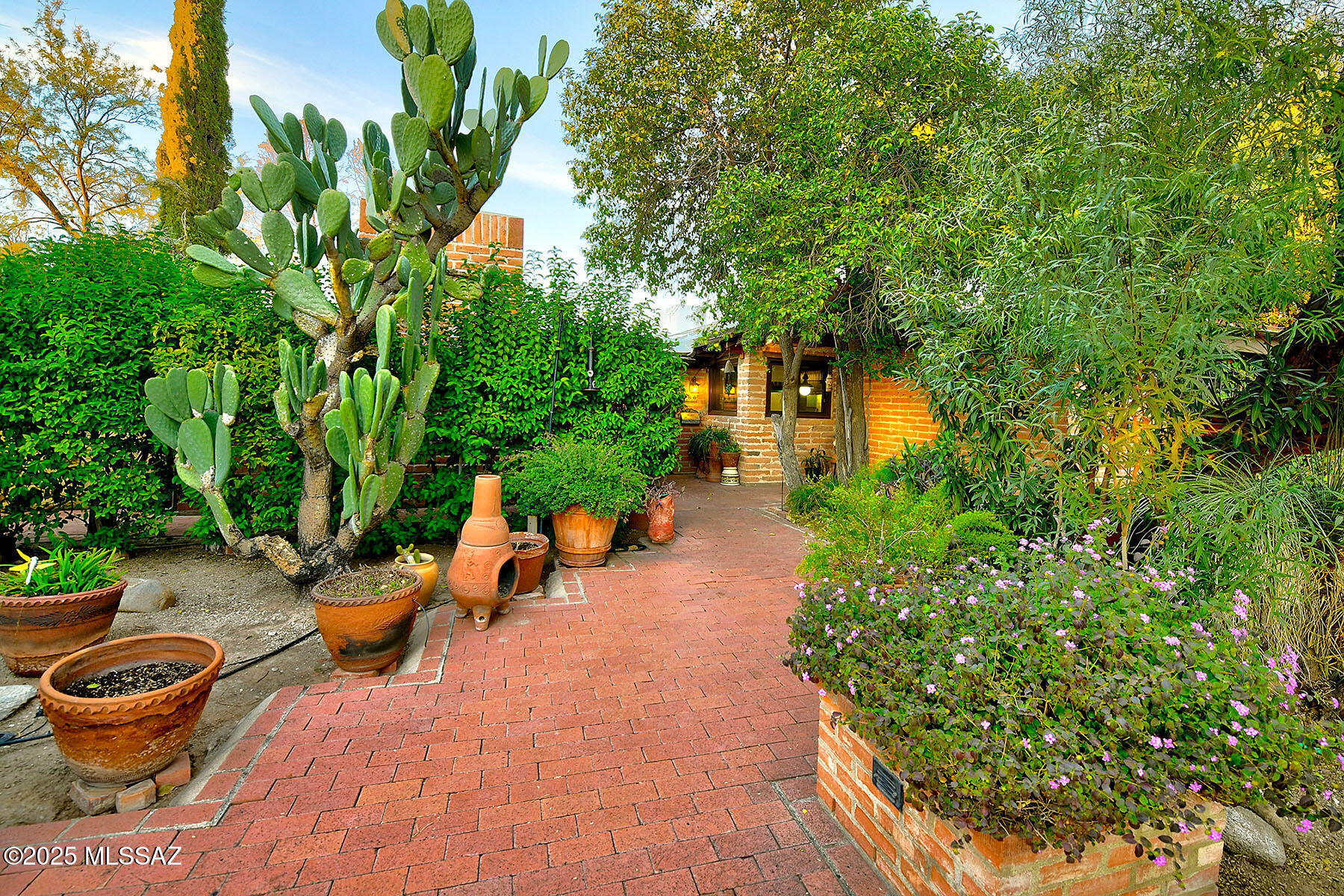 Nestled in Tucson's historic Ft. Lowell neighborhood, ''The Ranch'' is a charming compound owned by the same family for over 50 years. The property features a spacious 4,559 sqft adobe brick main house and a 1,303 sqft wonderful guest house with 2 bedrooms, 2 baths, and a full kitchen perfectly positioned for great mountain views on a lush 1.55-acre lot. Included is an additional 1.15-acre vacant parcel (contains some older/modest horse facilities) The main home is host to formal living and dining rooms, a cozy den,  executive home office, very large primary suite and endless potential. Ready for updating and a fresh vision, this is a rare opportunity in one of Tucson's most cherished historic neighborhoods.